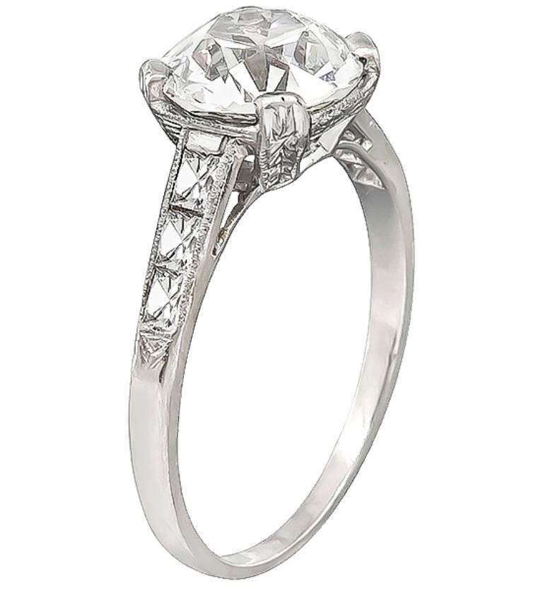 This amazing platinum engagement ring is centered with a sparkling GIA certified old European cut diamond that weighs 2.07ct. graded I color with VS2 clarity. The center diamond is accentuated by dazzling french cut diamonds that weigh approximately