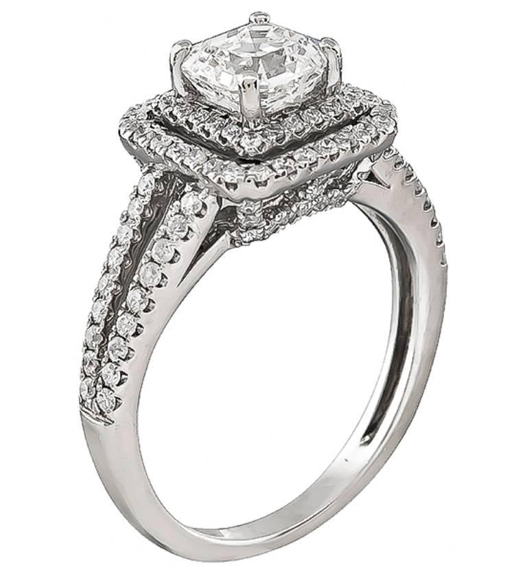 This charming 14k white gold engagement ring is centered with a sparkling GIA certified  Asscher cut diamond that weighs 1.06ct. graded G color with SI1 clarity. The center diamond is accentuated by dazzling round cut diamonds that weigh