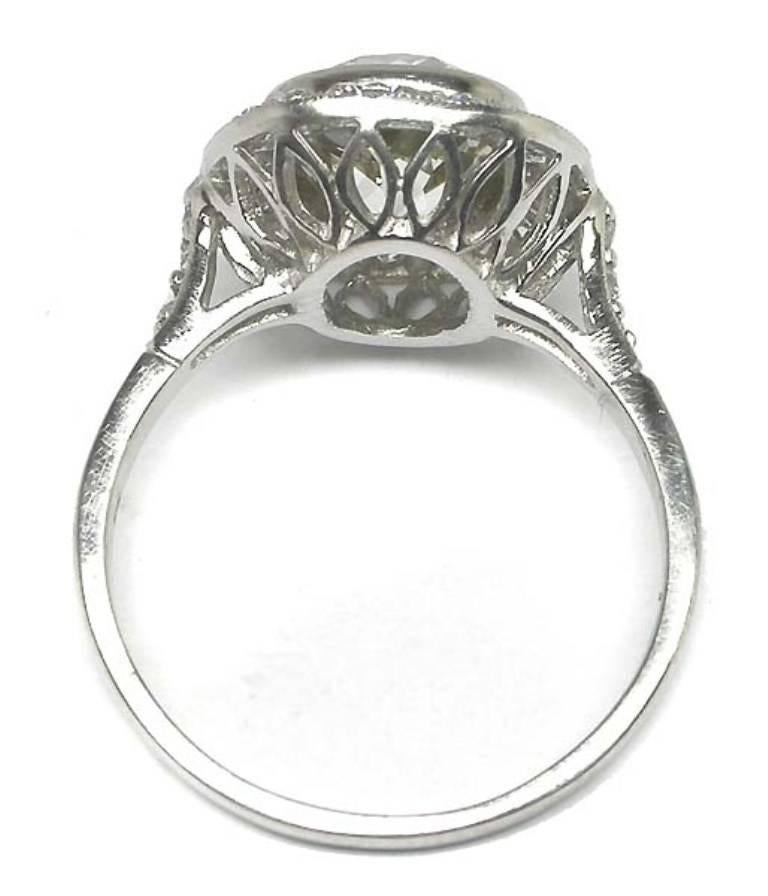 This stunning platinum ring is centered by a sparkling EGL certified old mine cut diamond that weighs 2.55ct and is graded H-I color with SI1 clarity. The center stone is accentuated by approximately 0.80ct of small old mine cut diamonds.  The size