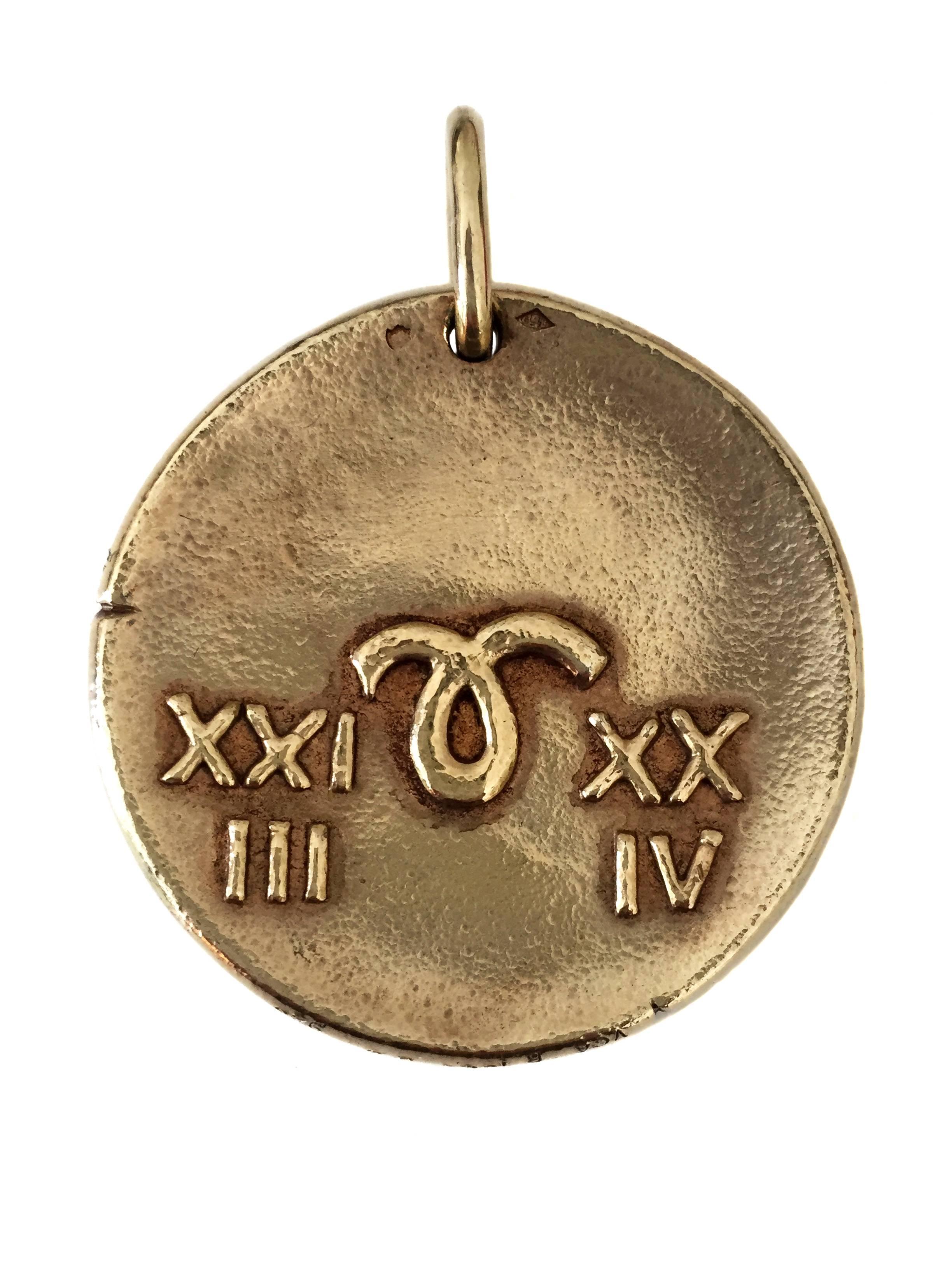 Van Cleef & Arpels - Gold - circa 1960

Designed in the style of an ancient coin, this Aries zodiac pendant is for those born between March 21- April 19th. The front of the pendant features a magnificent crafted two dimensional Ram. The reverse