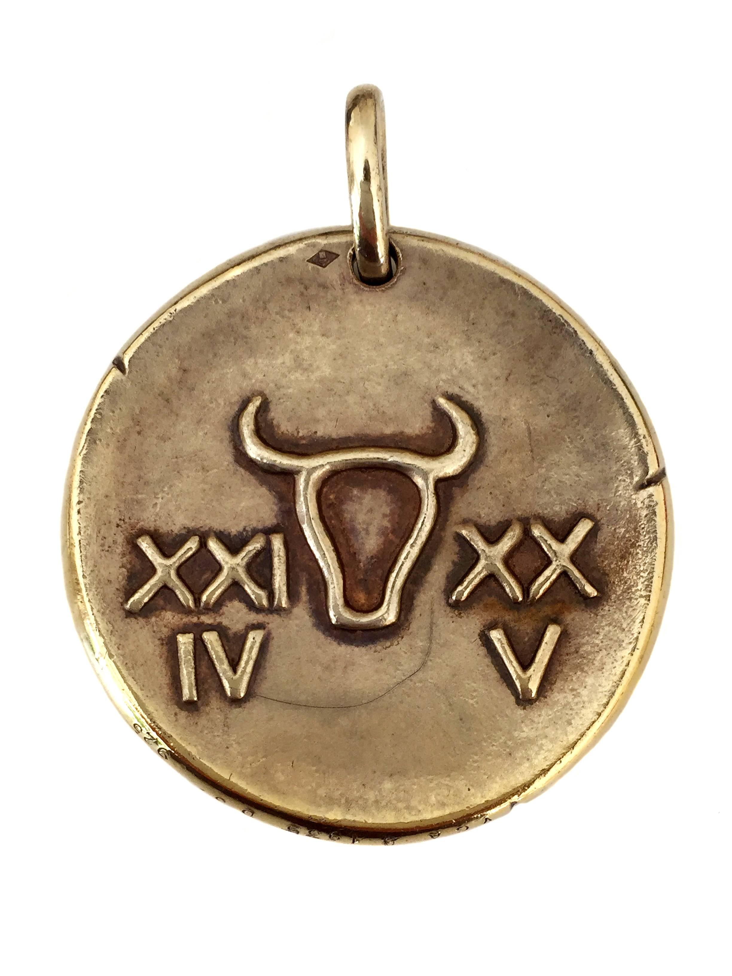 Taurus Zodiac Pendant - Circa 1960

Designed in the style of an ancient coin, this Taurus zodiac pendant is for those born between April 19- May 20. The front of the gold pendant features a magnificent crafted two dimensional Bull. The reverse side