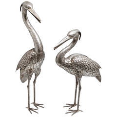 A large pair of silver herons by Manuel Alcino