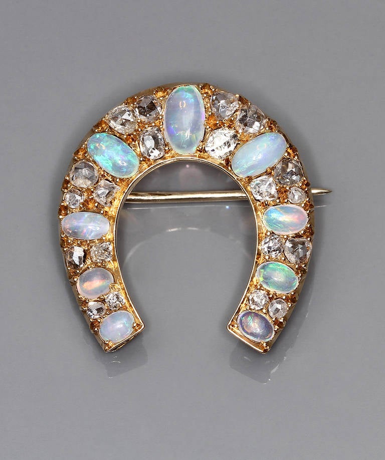 An Early 20th Century Opal Diamond Gold Horseshoe Brooch