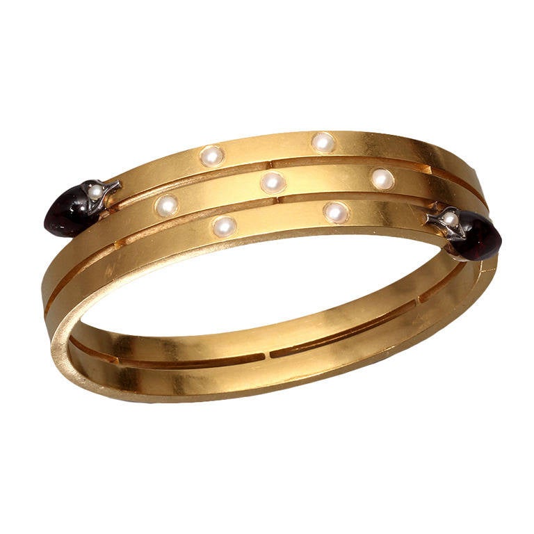 A Mid-20th Century Pearl Garnet Gold Bangle For Sale