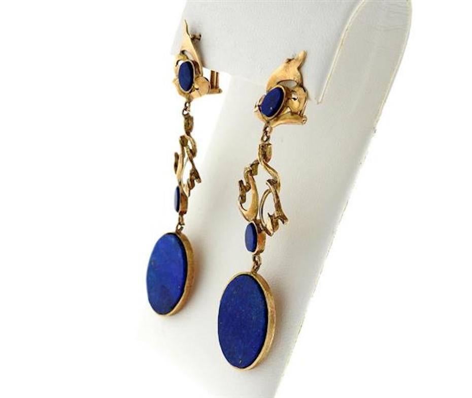 Striking long dangle shoulder duster earrings featuring blue lapis lazuli stones set in 14k gold (tested).  The earrings measure 71mm long x 20mm. The weight of the earrings is 14.4 grams.  See the coordinating bracelet and pendant for a beautiful
