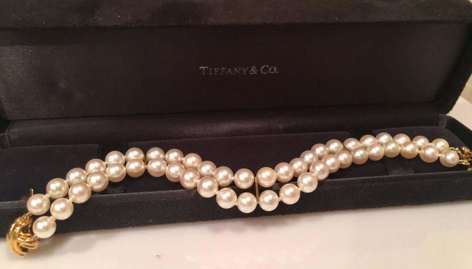 Gorgeous large "Signature X"  Tiffany & Co. 18k Yellow Gold Double Strand Cultured Pearl Bracelet.  The bracelet measures 8" from end of each clasp, with a wearable length when closed of 7.25".  The pearls measure