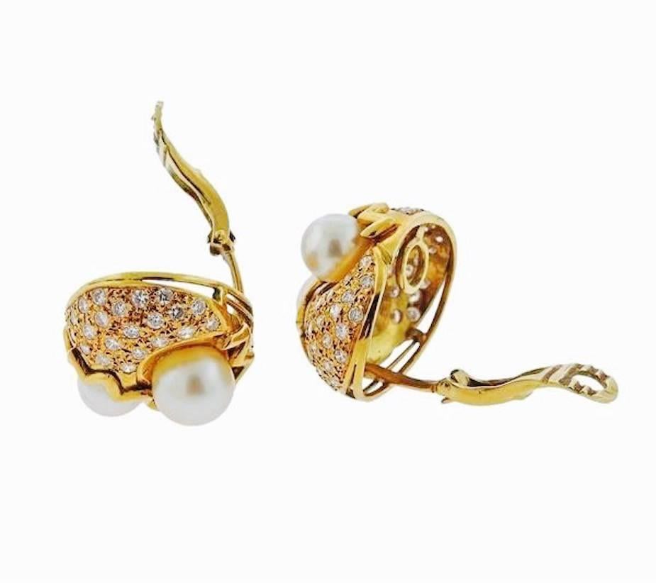 Impressive 18k Gold Earrings are set with two pearls each, one 8mm and one 9mm.  The earrings are set with 2.00 Carats of sparkling white brilliant cut diamonds as well.  The earrings measure a substantial 22mm x 23 mm (almost an inch each way) and