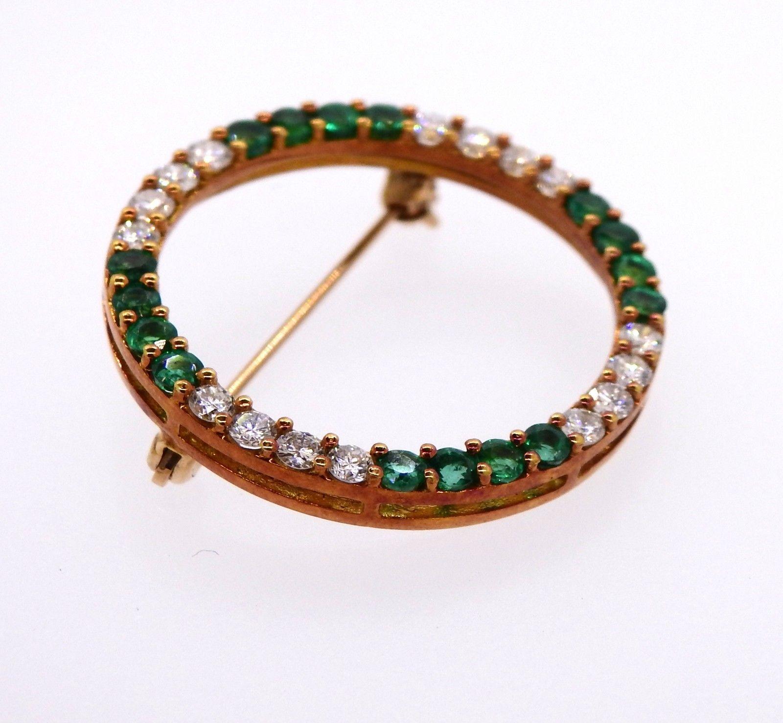 This lovley rare Herbert Rosenthal 18k yellow gold circle pin is set with 0.80 carats of round brilliant G-H VS diamonds and 0.80 carats of green lively round cut emeralds totaling 1.60 carats.

The brooch is marked 