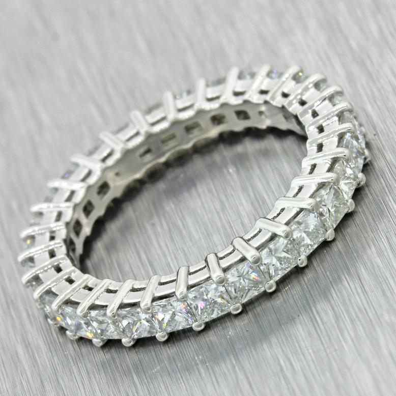 This gorgeous diamond eternity band features princess cut diamonds in a entire band setting. The band is sent with high quality G VS2-SI1 diamonds totaling approximately 2.51 carats.

The ring size is a 6.5 - It could be sized down with the addition