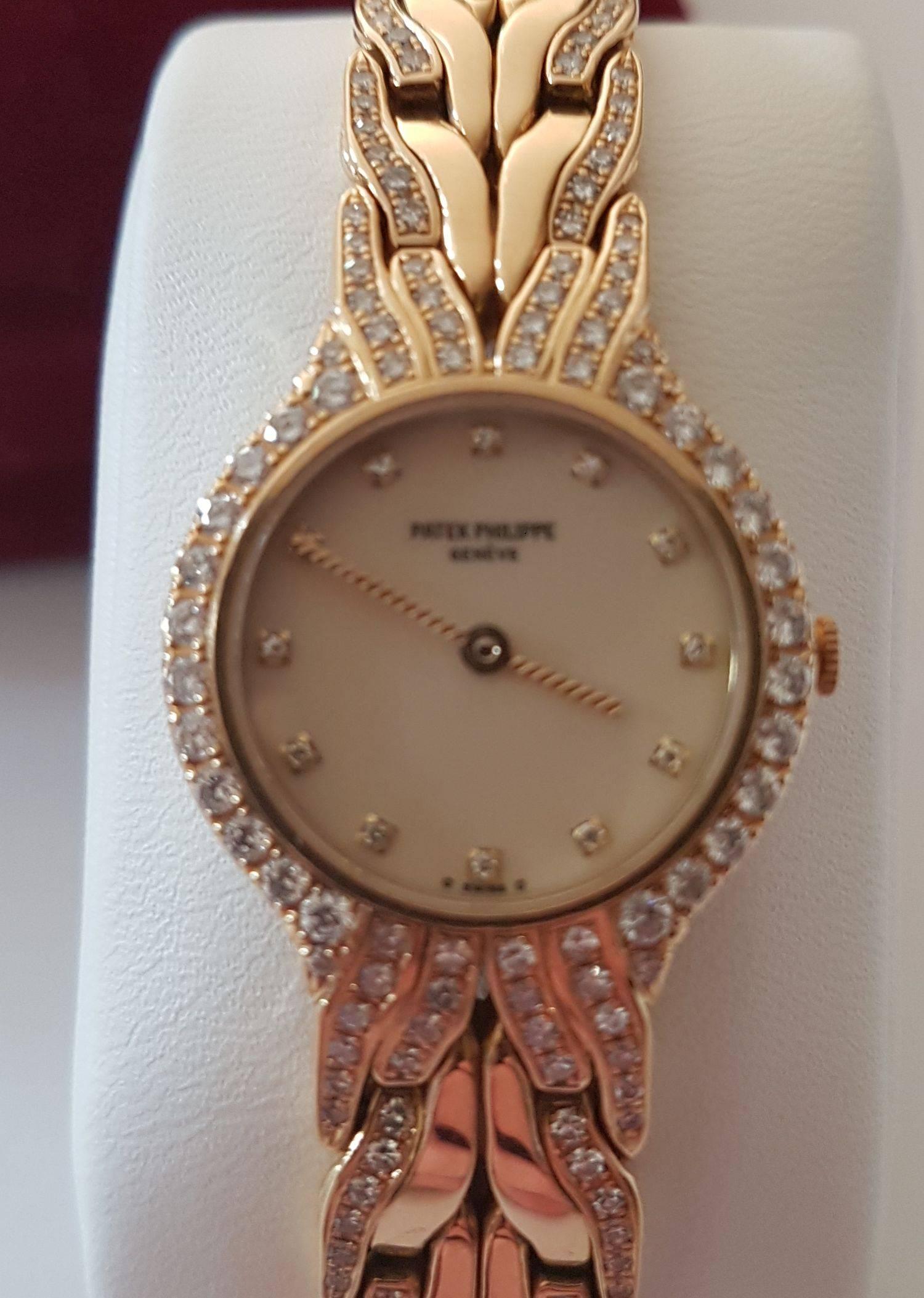 Stunning ladies Patek Philippe La Flame diamond set watch.  

This watch is in pristine condition and has diamond hour markers, a diamond bezel and diamond set bracelet.  It is 18 ct yellow gold and keeps perfect time.  The bracelet length is and