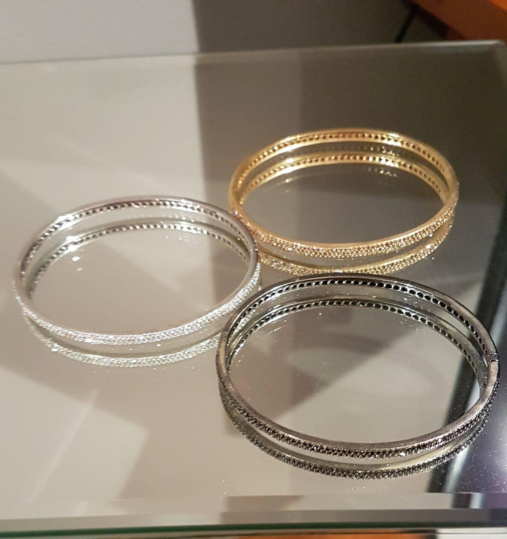 Three stunning diamond bracelets.  These bracelets are by Pascal which was re-branded as Annoushka so very high end and worn by a number of famous names (Gwyneth Paltrow etc).  The bangles are three different colours of gold and three different