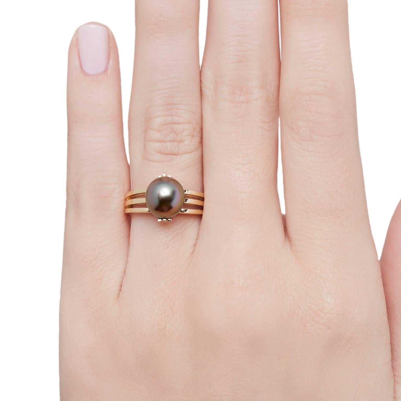 Inspired by an old world globe, this elegantly set Globe Ring from Cushla Whiting's Metropolis Collection, holds in place a beautiful Tahitian black pearl. 

The GLOBE ring is made in 18 carat gold holding a Tahitian black pearl.

One ring in stock,