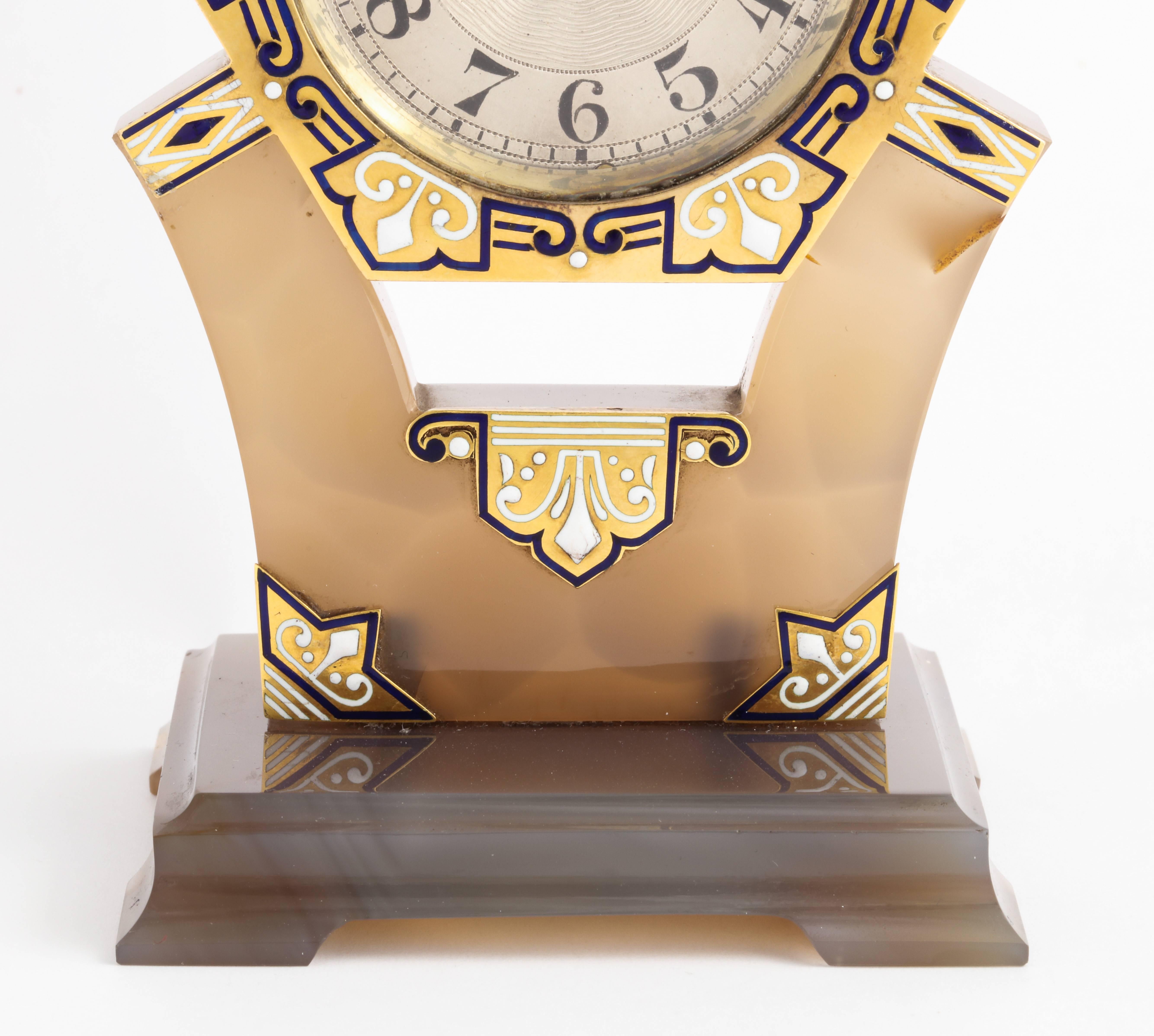 Art Deco Tiffany and Co Clock  

Comprised of: gold, silver, carved hardstone, old cut diamonds, and blue and white enamel.

Made circa 1925

Dial signed Tiffany & Co. French maker's Mark stamps

Depicted in full page spread in the 