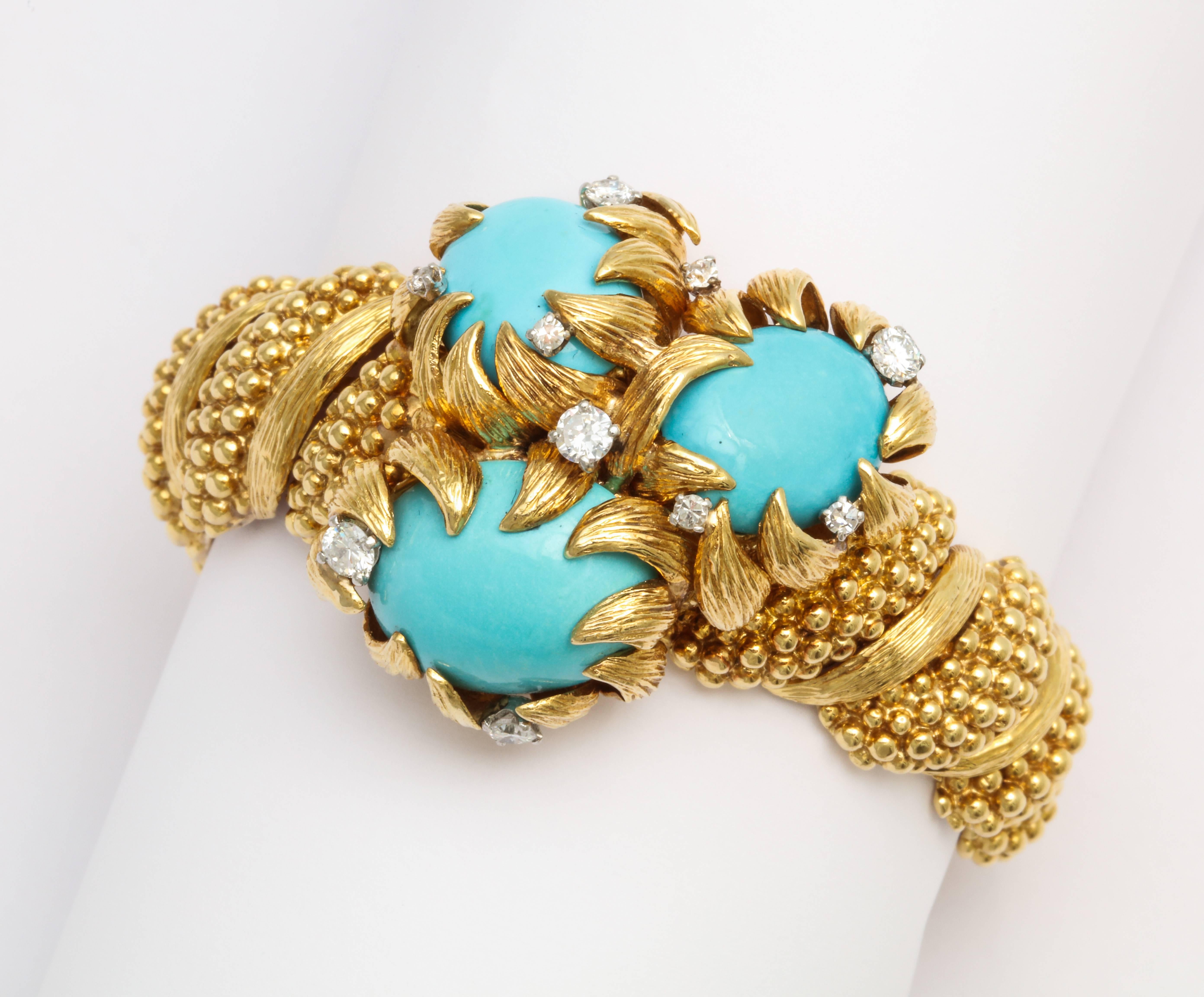David Webb Turquoise Diamond Bracelet

3 Turquoise weigh approx 45 carats 

Set in 18 Karat yellow beaded and textured gold

Signed Webb