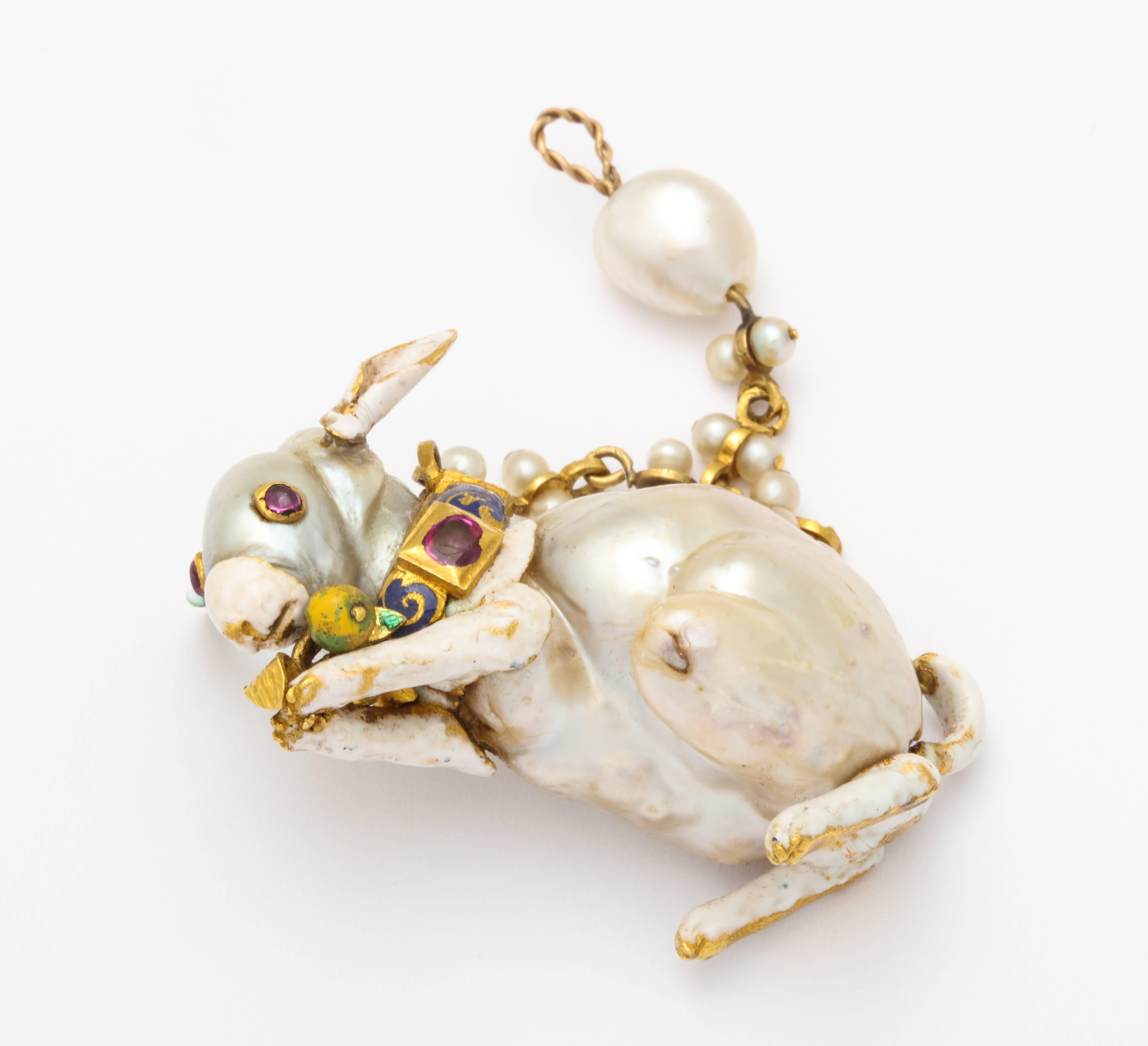 Natural Pearl Renaissance Revival Enamel Gold Rabbit Pendant Brooch

A very creative and unique natural baroque pearl set as the body of rabbit. Designed with multi color enamel  and rubies.

European Make. Circa 1850

Depicted in full page spread