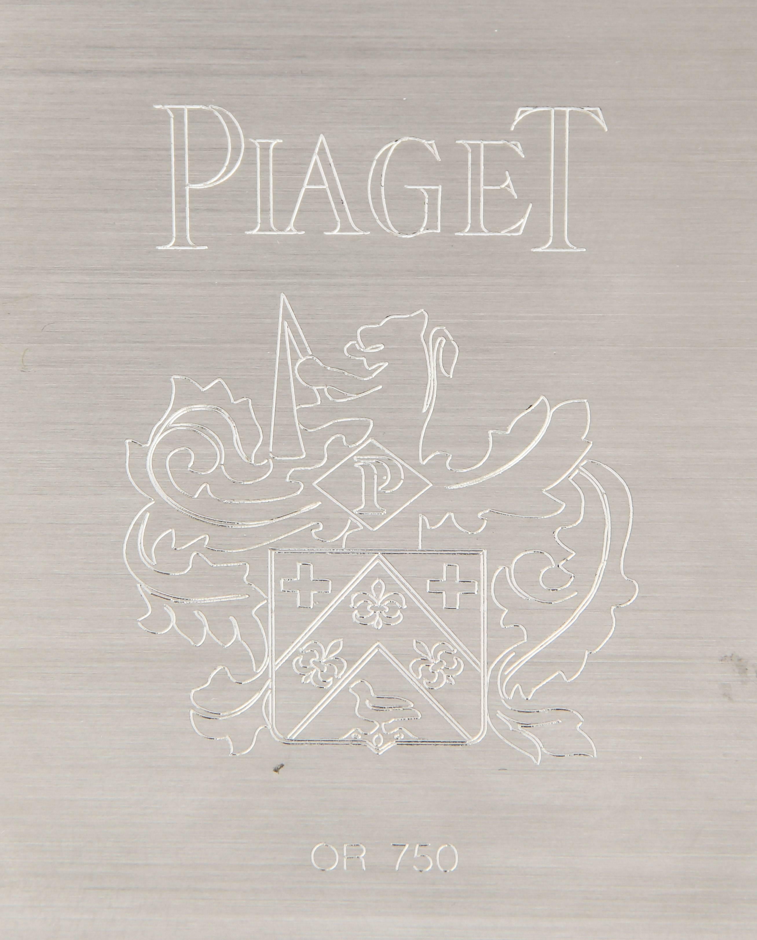 PIAGET ART-DECO STYLE MOTHER OF PEARL DESK CLOCK WHITE GOLD & DIAMOND 

Piaget, Swiss. Made circa 2000. Elegant and very fine, solid 18K white gold, diamond, lapis-lazuli and mother of pearl-set, 8-day going, keyless, Art-Deco-style table clock