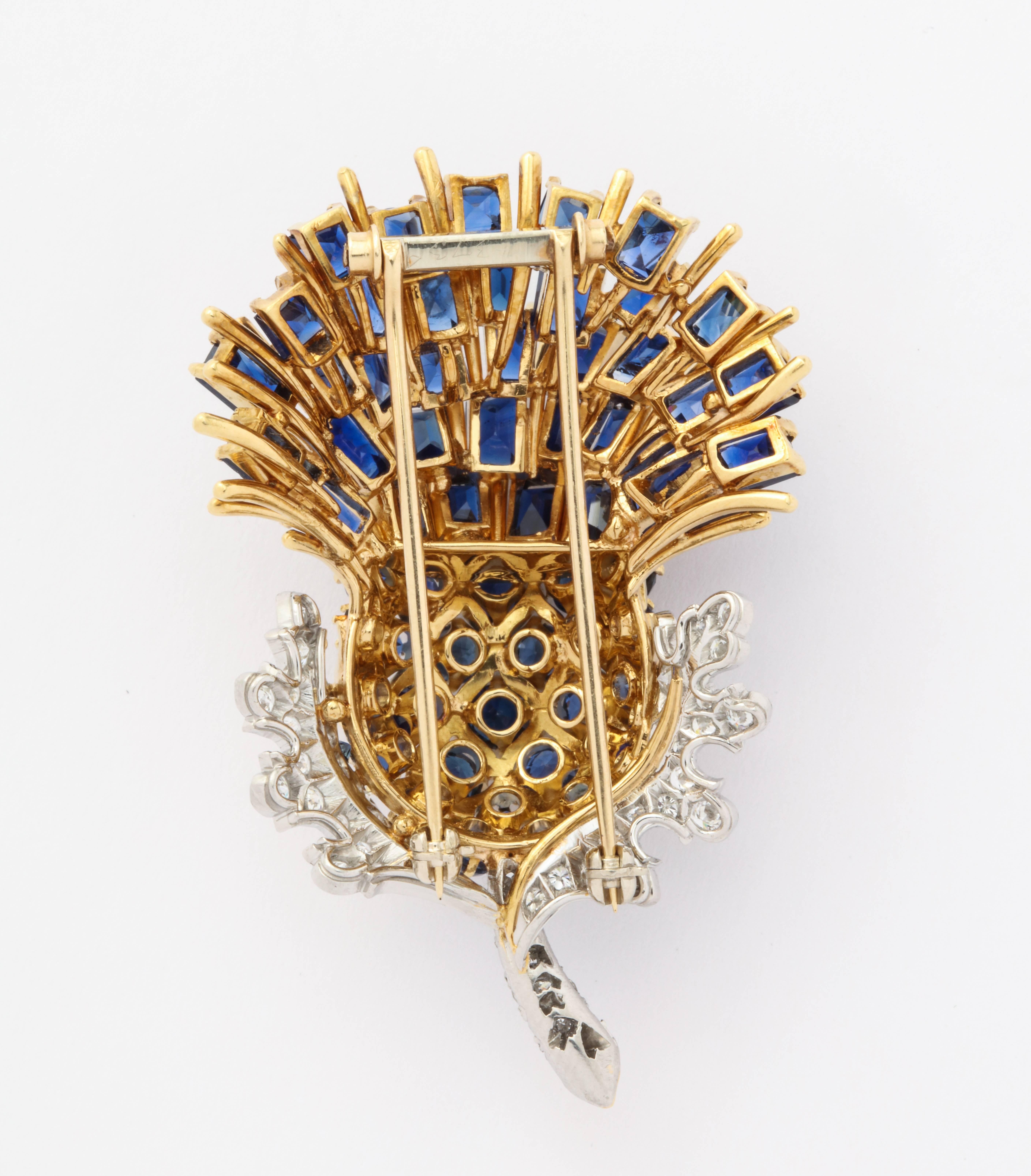 Black Starr and Frost Sapphire Thistle Brooch

18 Karat Gold, 10.25 ct of sapphires

American made Circa  1950