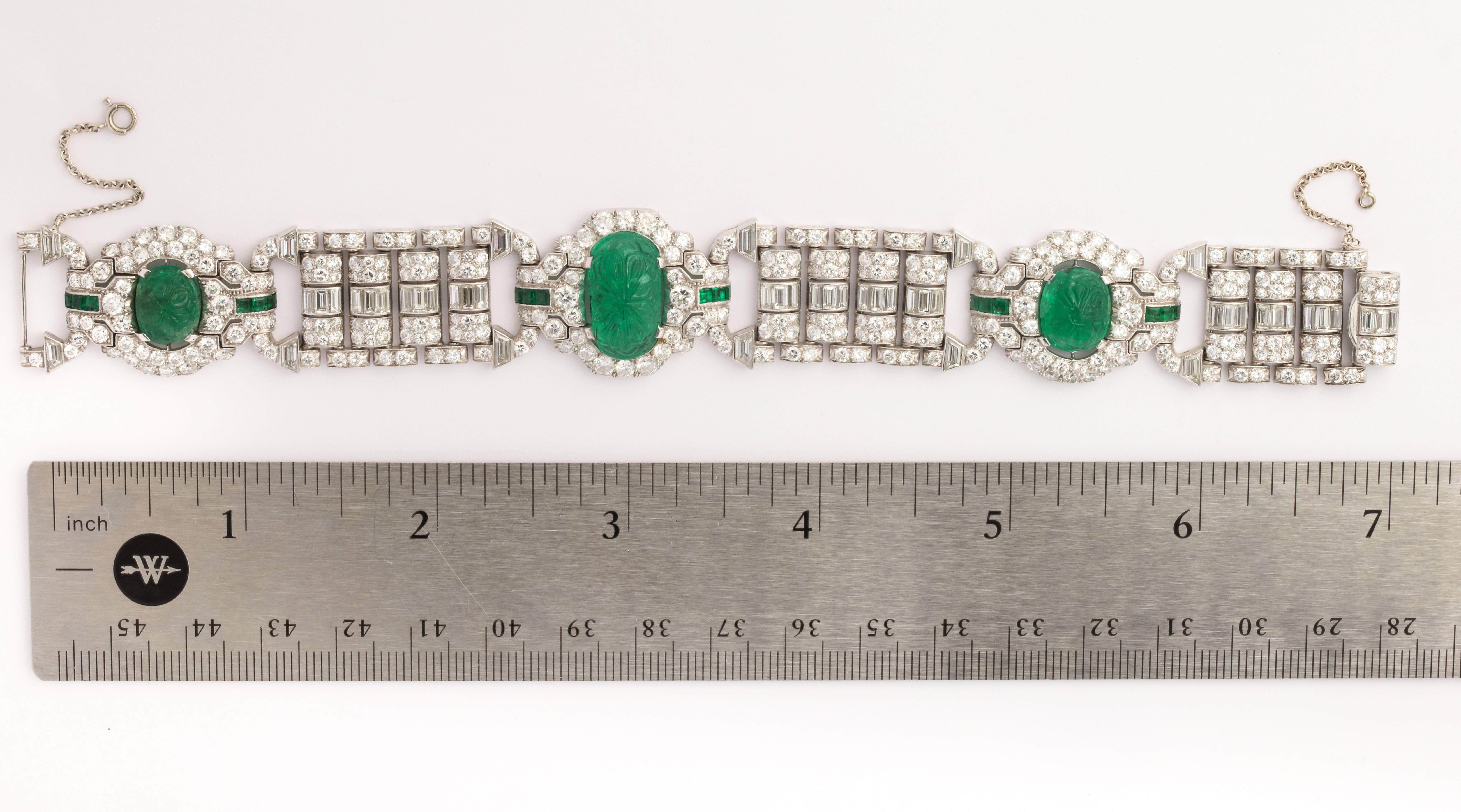 A beautiful Carved Emerald and Diamond Bracelet

Featuring three very rare antique emeralds

Made Circa 1920

Measurements: 7