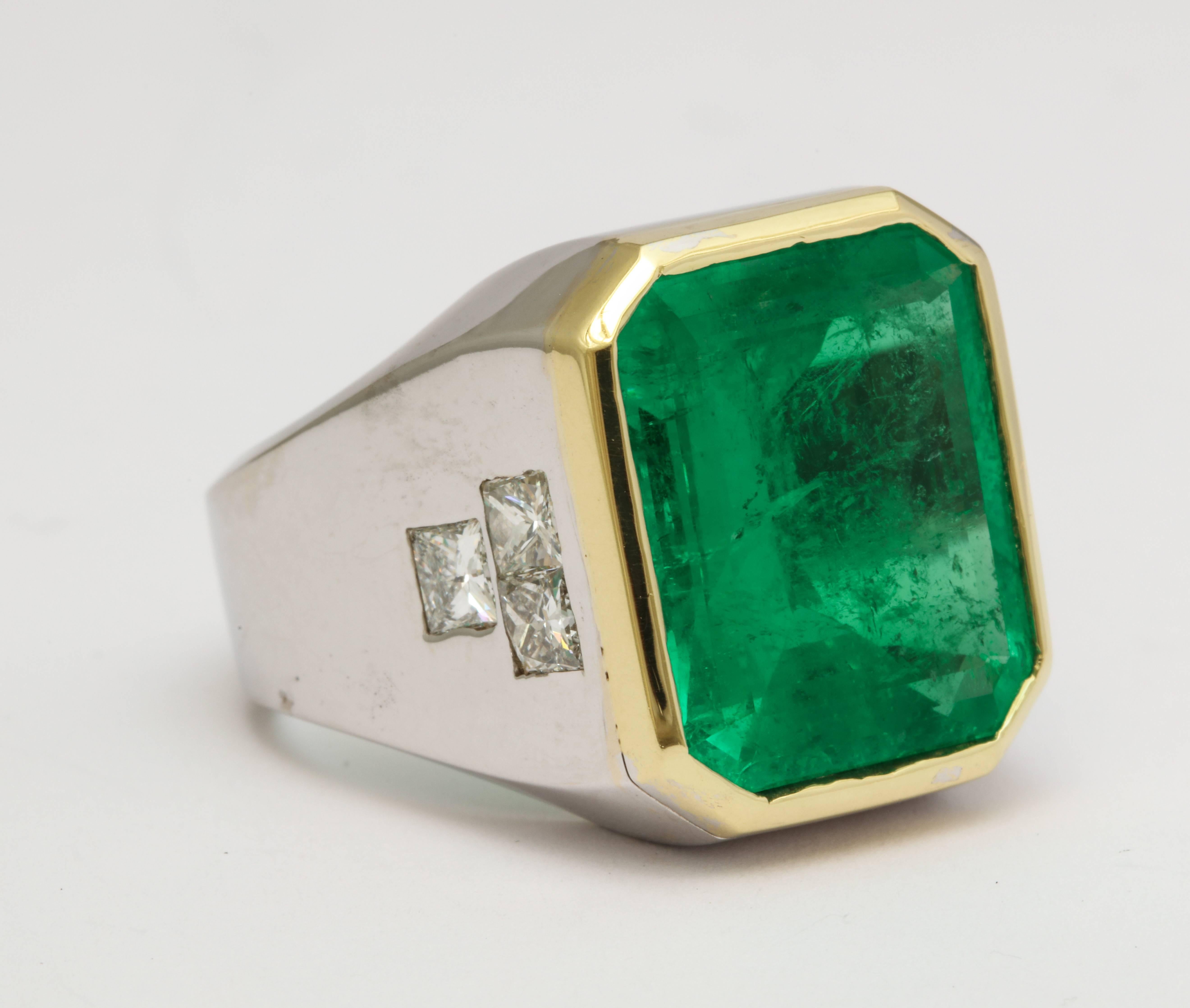 A very fine 13.34 carat Colombian Emerald Gentleman's Ring

Emerald has AGL Certificate stating the emerald is Colombian, with Minor oil.

1.72 ct of diamonds, 18 karat gold

The stone weights are engraved on the inside of the ring

