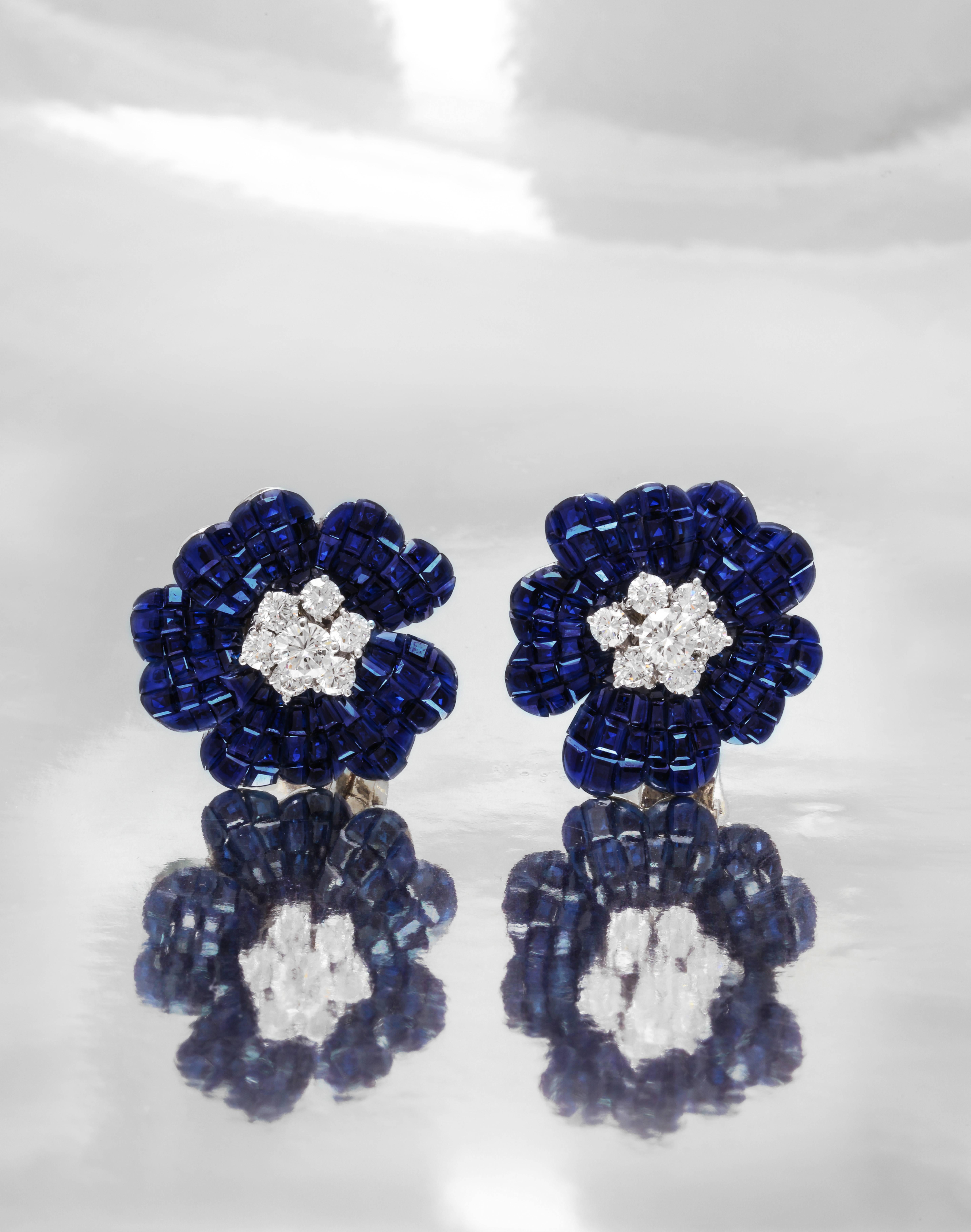 A Very Rare Van Cleef and Arpels Mystery Set Sapphire and Diamond Brooch and Earrings Set

The brooch is one of the larger models made. Measuring a very impressive: 2.1 inches wide and 2.75 tall

The earrings measure: 1 inch wide

A iconic example