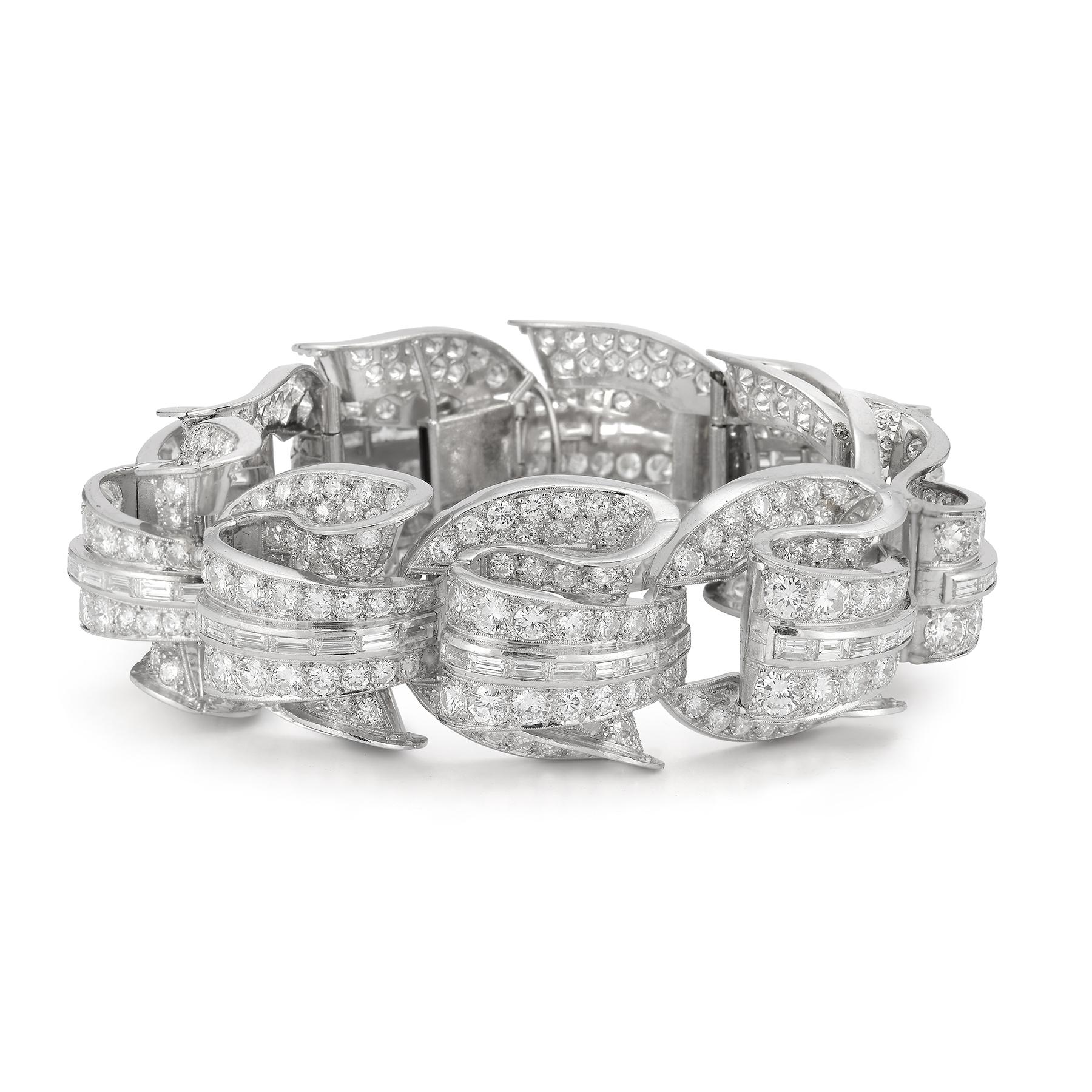 Incredible Geometric Art Deco Diamond Bracelet
Very geometric and three dimensional. A masterpiece of Art Deco design and Craftsmanship. 
Diamond Weight:  Approximately 40 carats
Measurements: 7