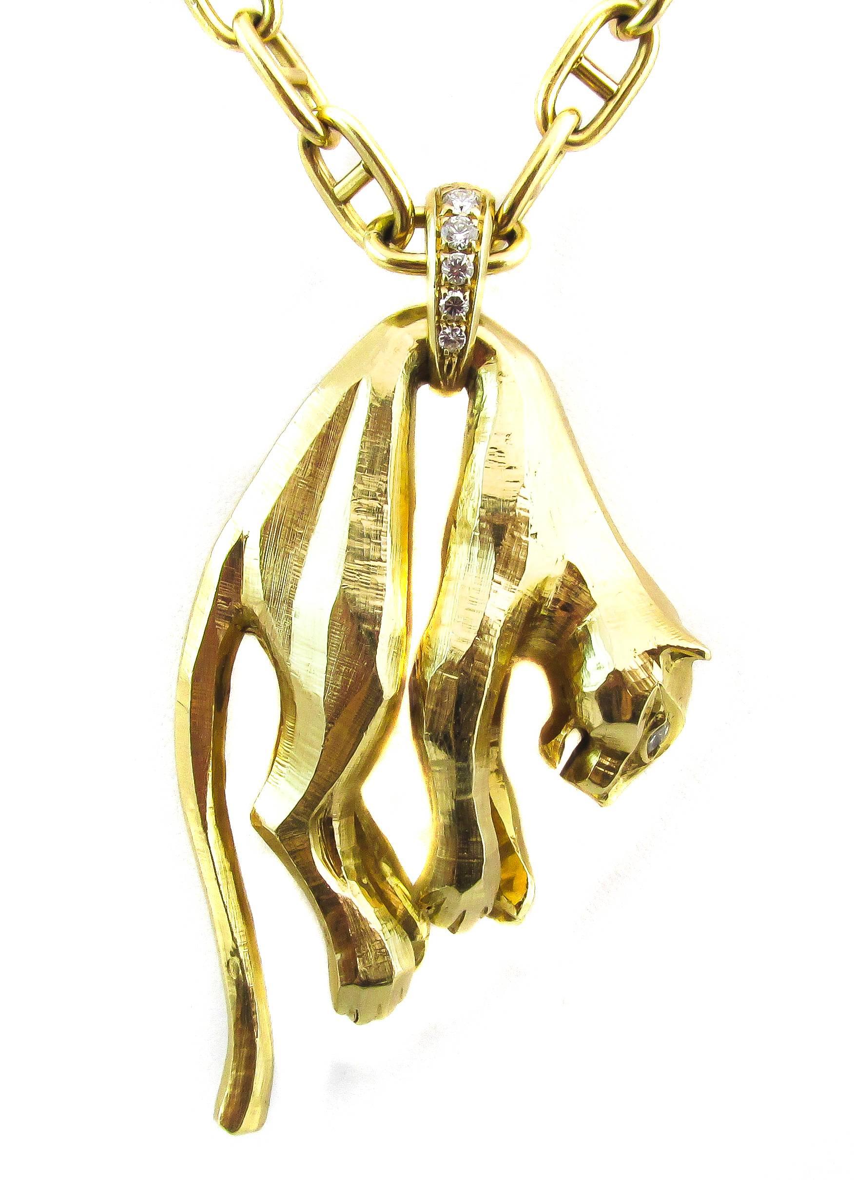 18 karat yellow gold Cartier Panther necklace. The panther, for which Cartier jewelry is famous for, was recreated in the 1980’s for this necklace. Both eyes are set marquise cut diamonds to give them a true catlike appearance and the three