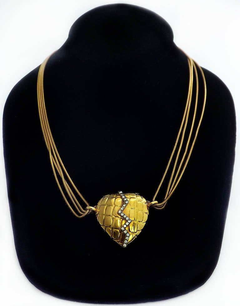 Gucci 18 karat, yellow gold and diamond heart shaped pendant necklace, 20 diamond approx. 0.4 cts, adjustable length, signed Gucci, Italian hallmarks, circa 1990