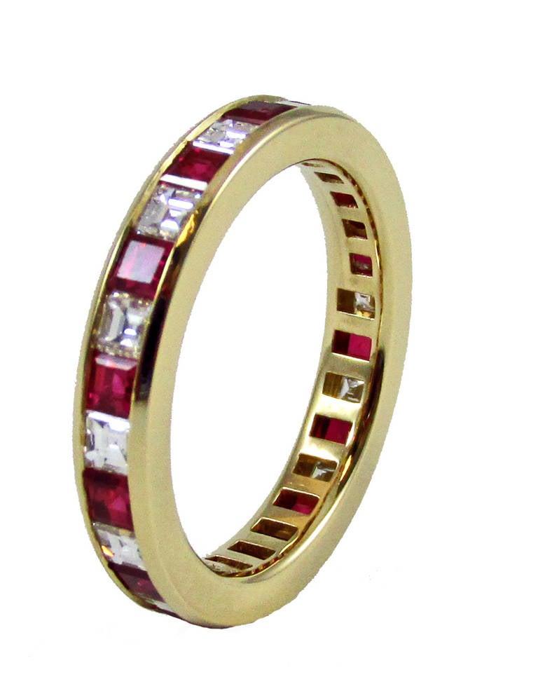 Tiffany & Co. 18 karat gold band with approximately 1.25 carat total weight of 14 diamonds and approximately 1.50 carats total weight of 14 rubies, diamond average color: G-H, diamond average clarity: VS, ruby average clarity: Fine, size: 6 (not