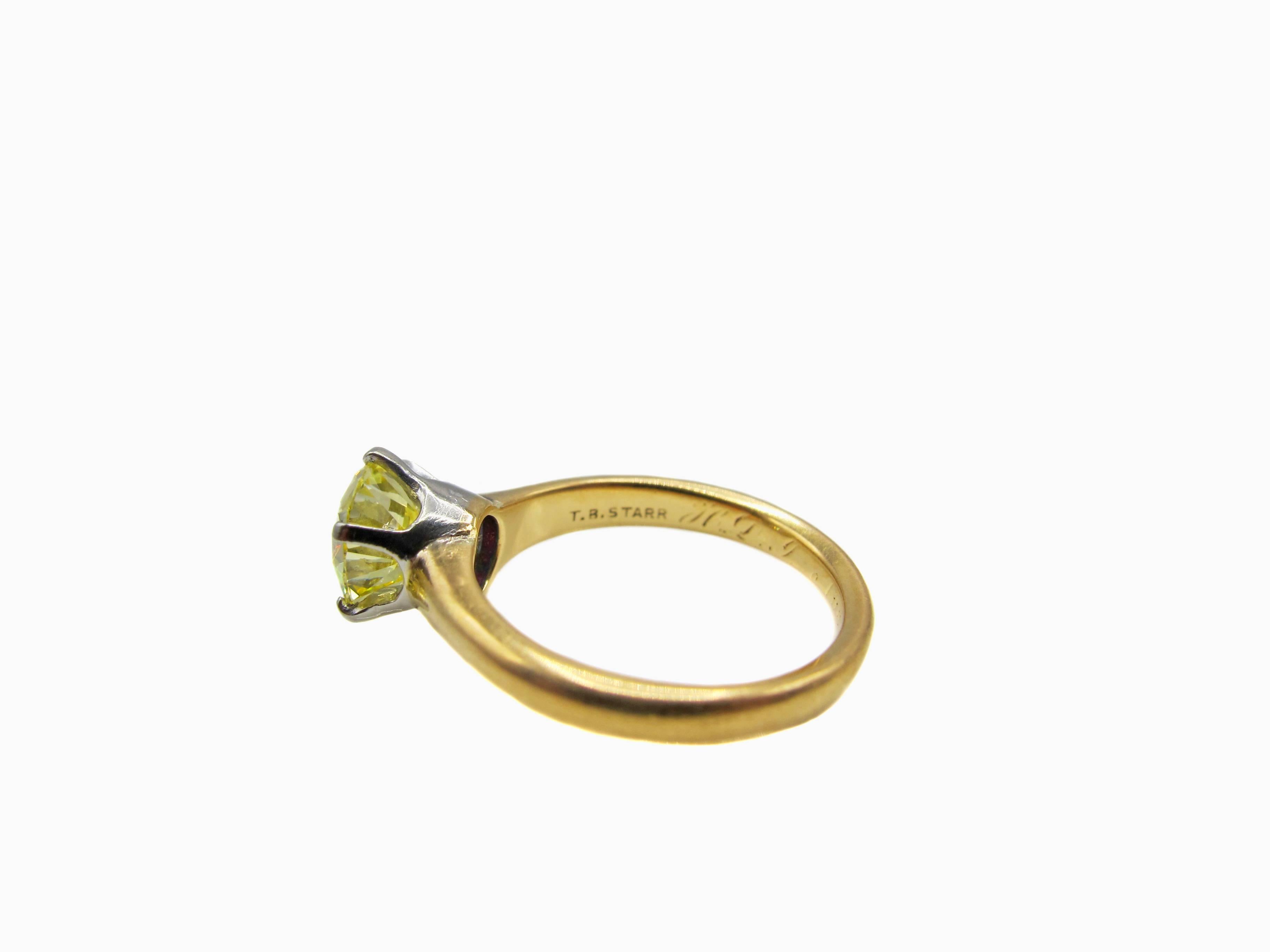 Amazing Canary yellow Old European Cut diamond solitaire ring from ca. 1900 by the famous American Jeweler " T.B. Starr " who later joined the firm Black, Starr & Frost. Held in a cup hand crafted out of platinum and secured by 6