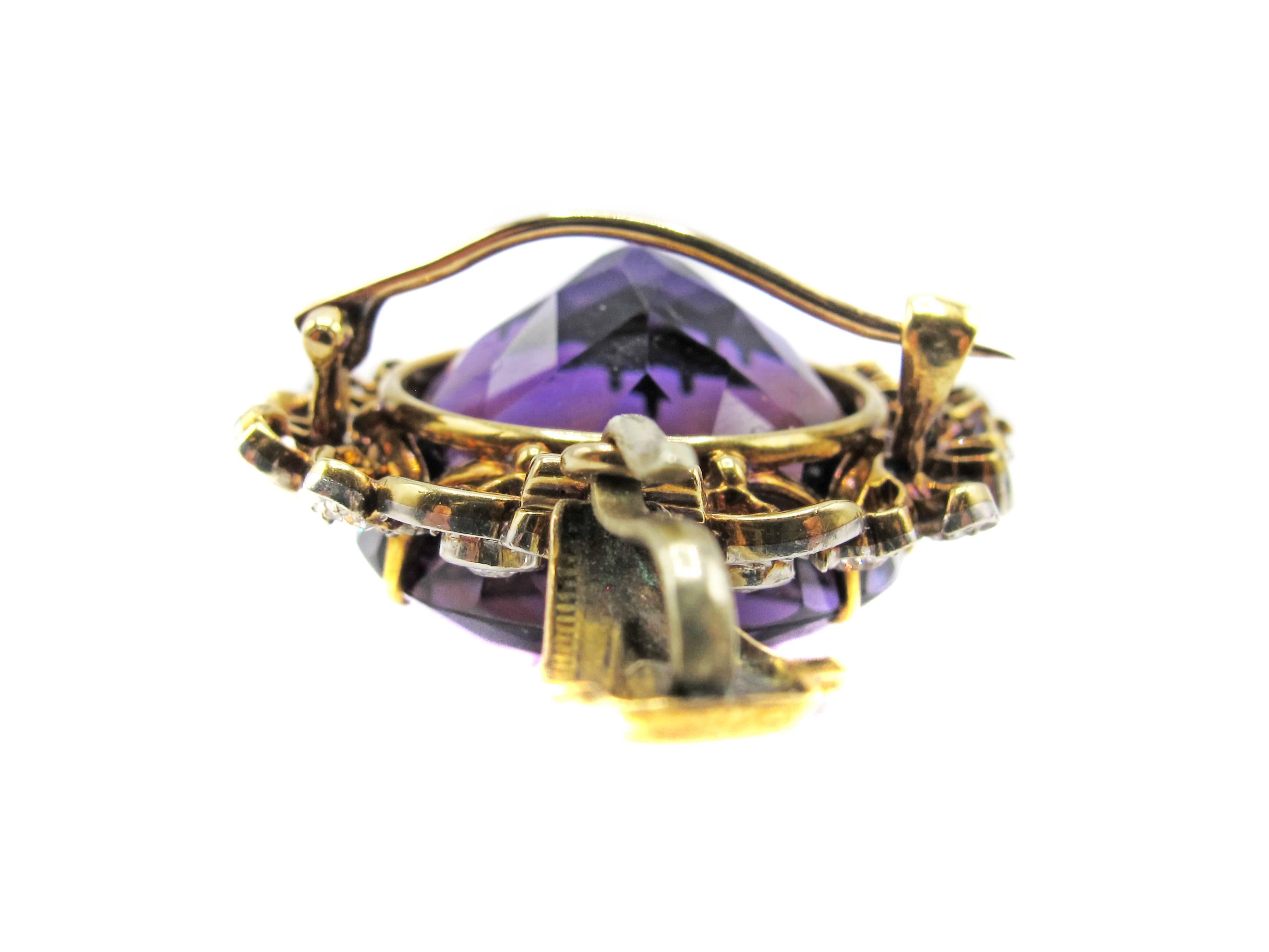 An amazing Siberian amethyst measured to weigh between 55-60 carats is the center piece of this incredible Belle Epoque pendant-brooch. The faceted round extremely well cut Amethyst displays a unique color saturation of deep bright purple with