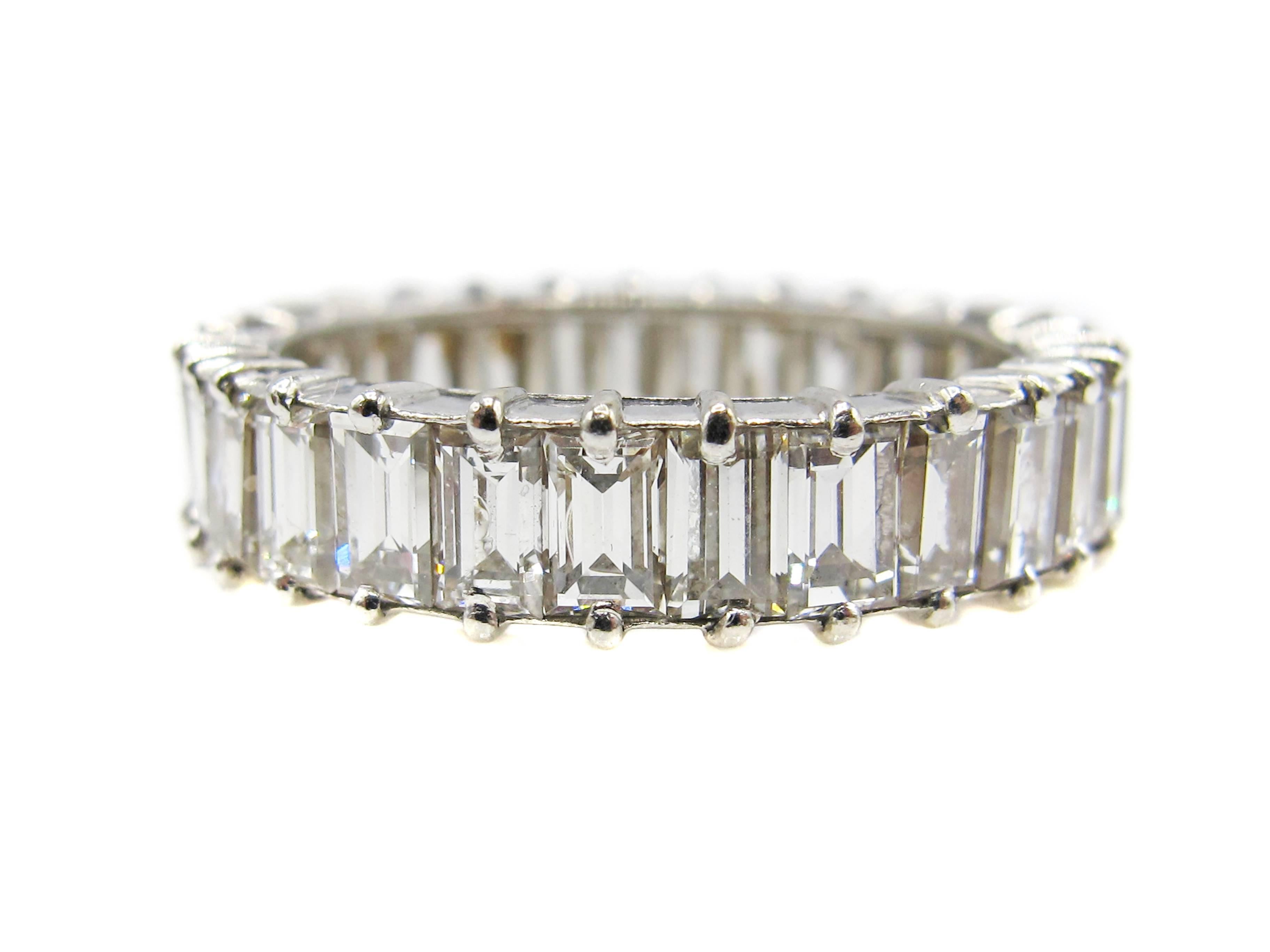 Incredibly well hand crafted French platinum baguette diamond eternity band prong set with 29 bright white baguette cut diamonds weighing approximatley 3.50 carats. Each diamond has been picked to perfectly match the others in cut, clarity and