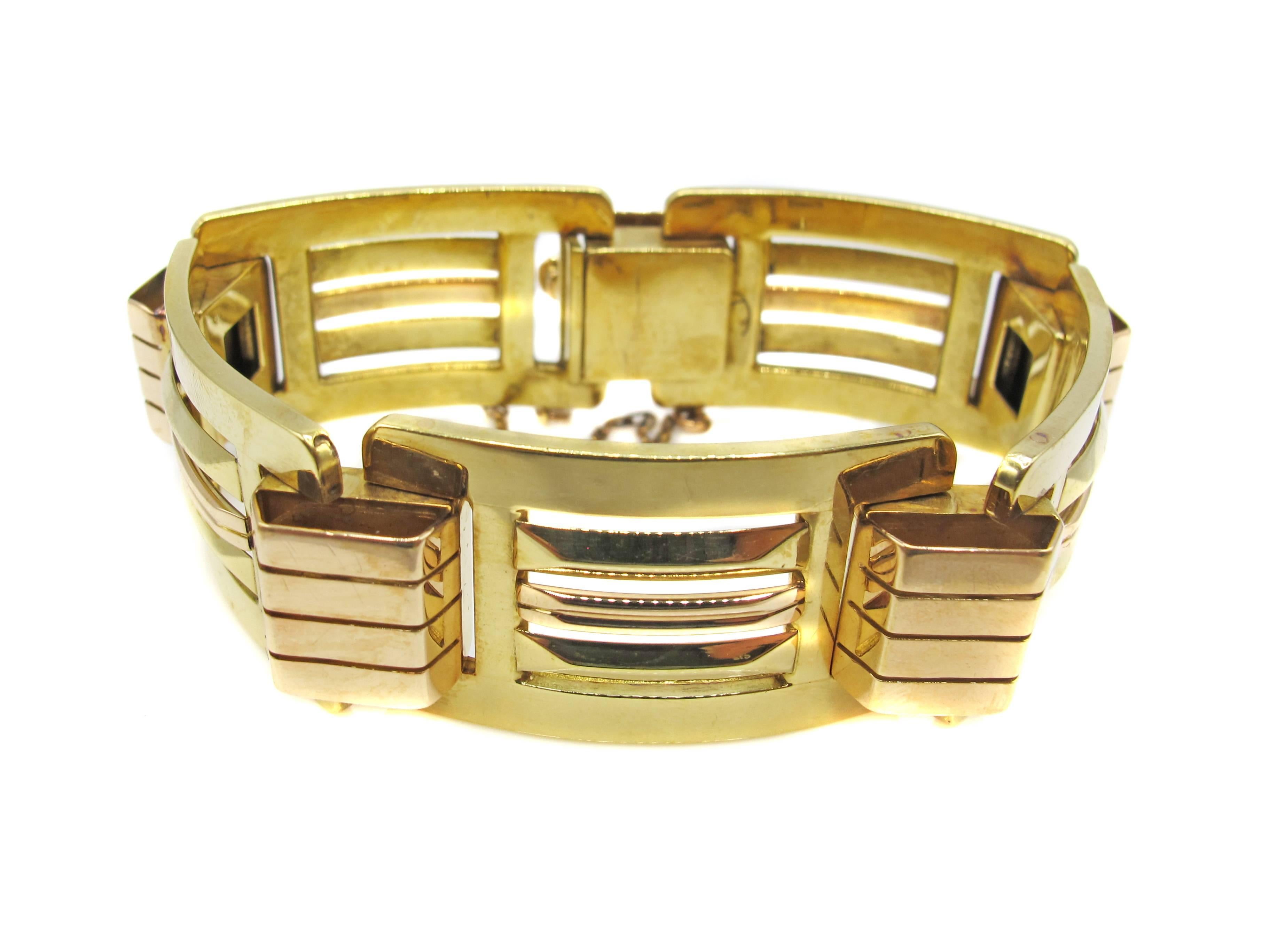 Interesting 18 Karat Retro Machine Age bracelet ca. 1945 designed with 5 yellow gold rectangular elements alternating with 5 raised rose gold tank track elements. The contrast of color and variation of width give this period piece a great three