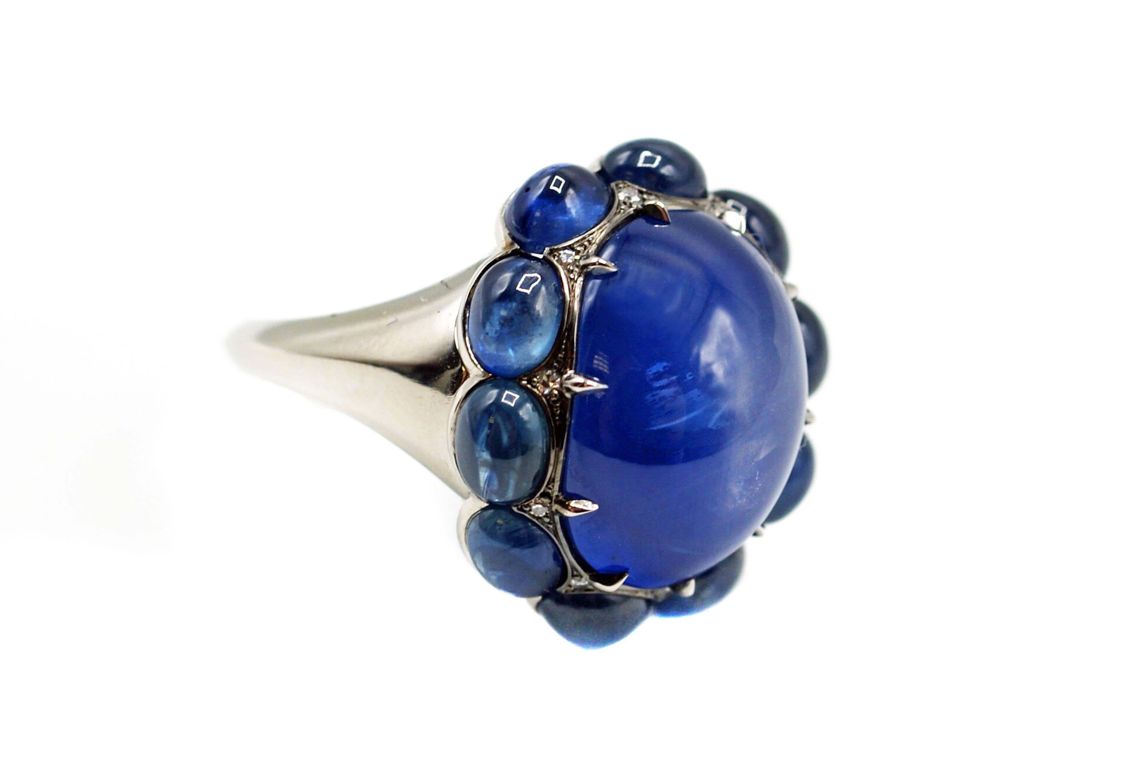 This exquisite unique ring, designed by Rive Gauche Jewelry was handcrafted in platinum by our master jewelers to reflect a contemporary and timeless chic. The center piece of this ring is a perfectly cut 21.36 carat rare Burma star sapphire with an