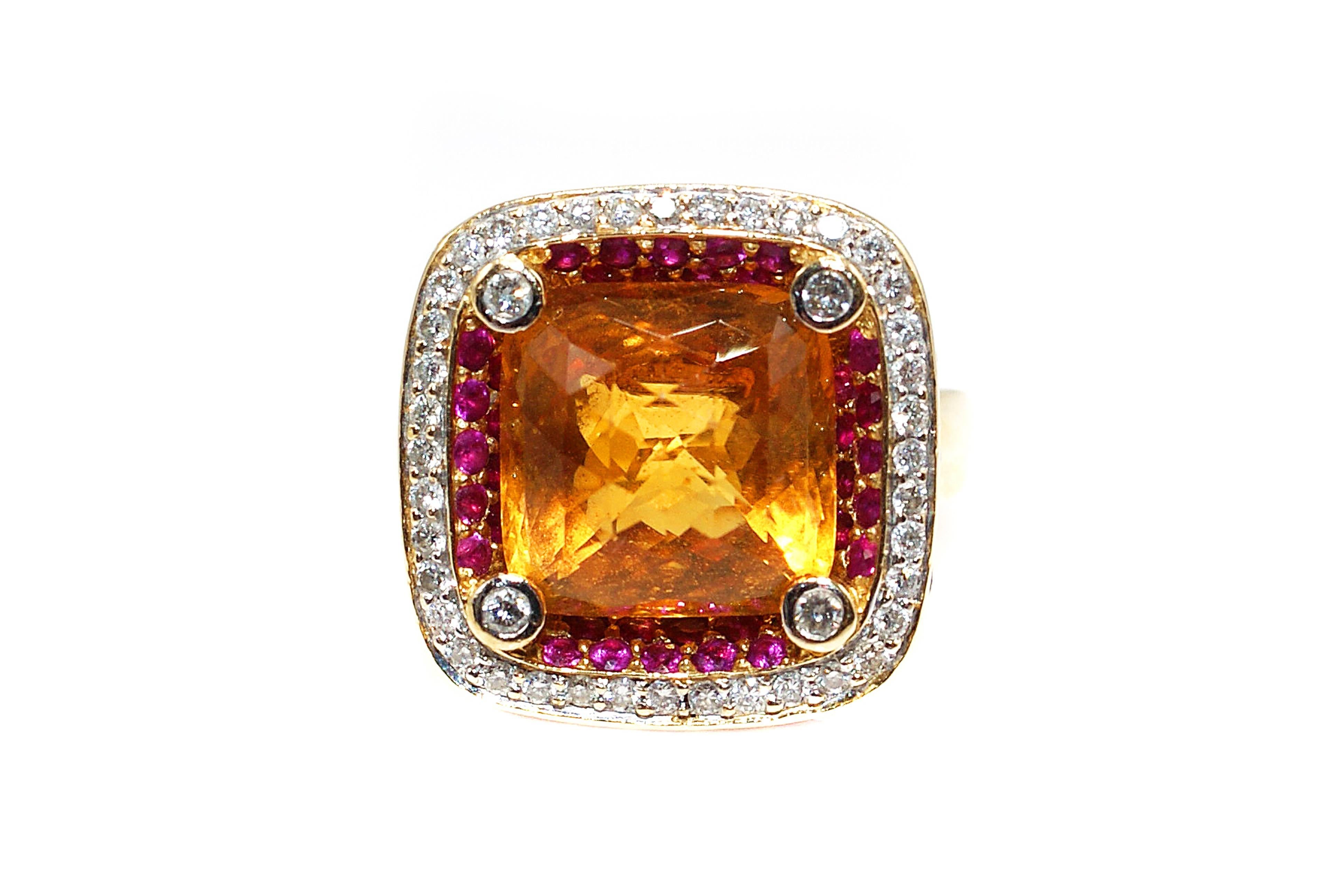 This unique ring features a 3.12 carat faceted rose cut Citrine with a small diamond on each of the four corners and two rows of pink sapphires immediately surrounding the stone. A row of channel set bright white and sparkly diamonds all surrounded