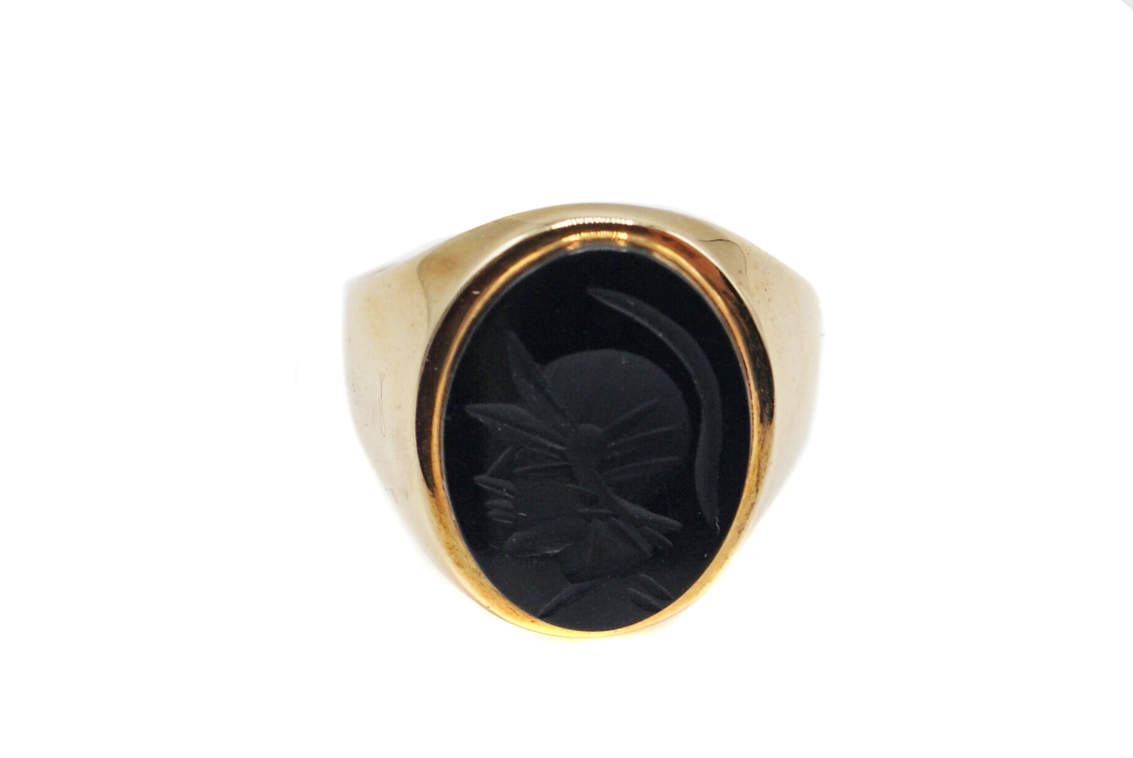This unique ring features a profile of a Roman Soldier detailed in black onyx with a shiny finish. The beautifully carved face is indicative of another time, bringing an element of antiquity to the ring. Intaglio measures 16 mm x 12 mm. The inside