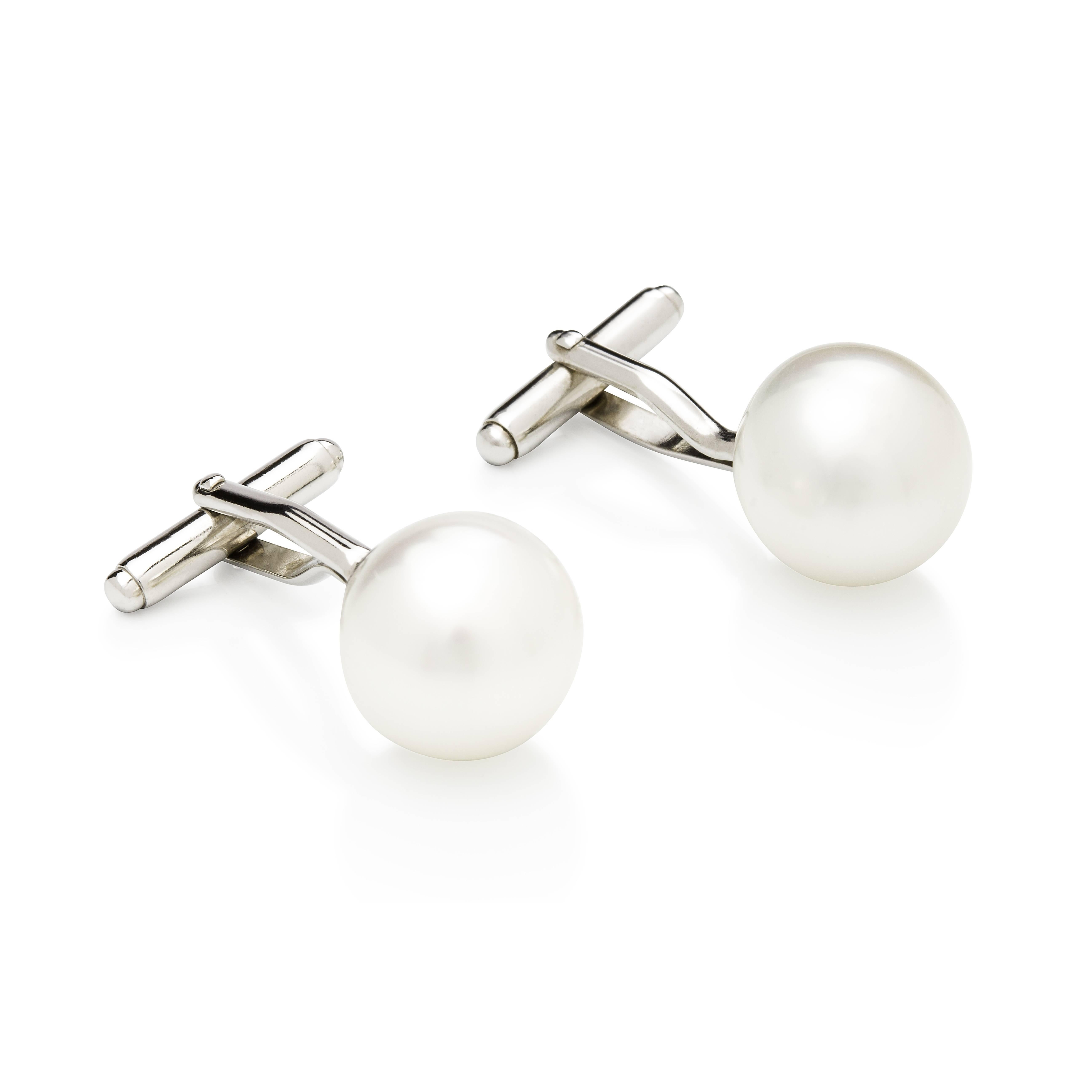 Style for Men...

18 carat white gold cuff-links with 12-13 mm, button shape, high quality (no blemishes or marks), high luster, white color, Australian South Sea pearls.

Button shaped pearls are perfect for cuff-links so they sit just right with