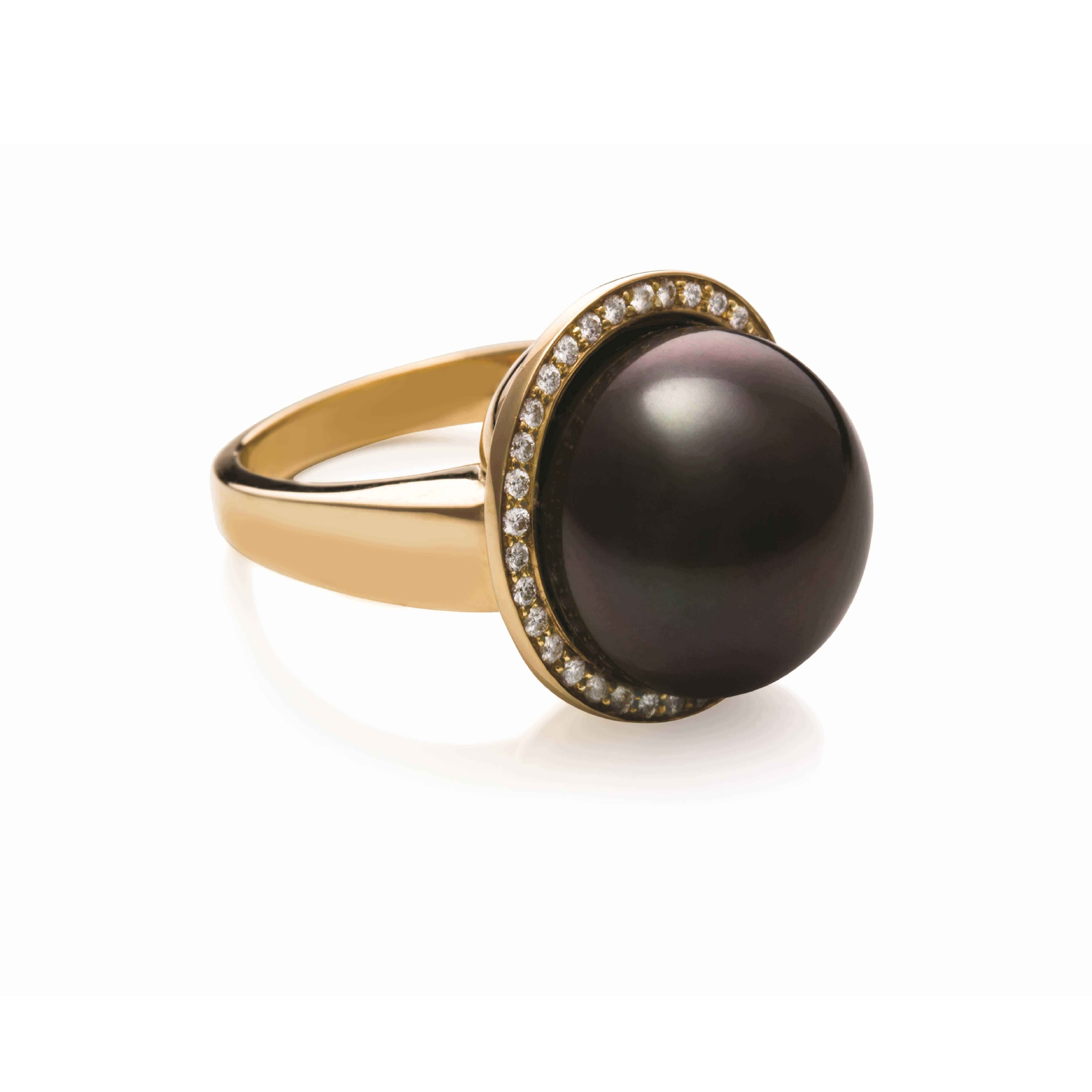 This stunning bold ring is made of 9 carat yellow gold which is encircled with 0.31ct diamonds.

The centre pearl is a 0.6 inches / 15.3mm Tahitian South Sea pearl, near round in shape, stunning strong colour with clear surface with a strong even