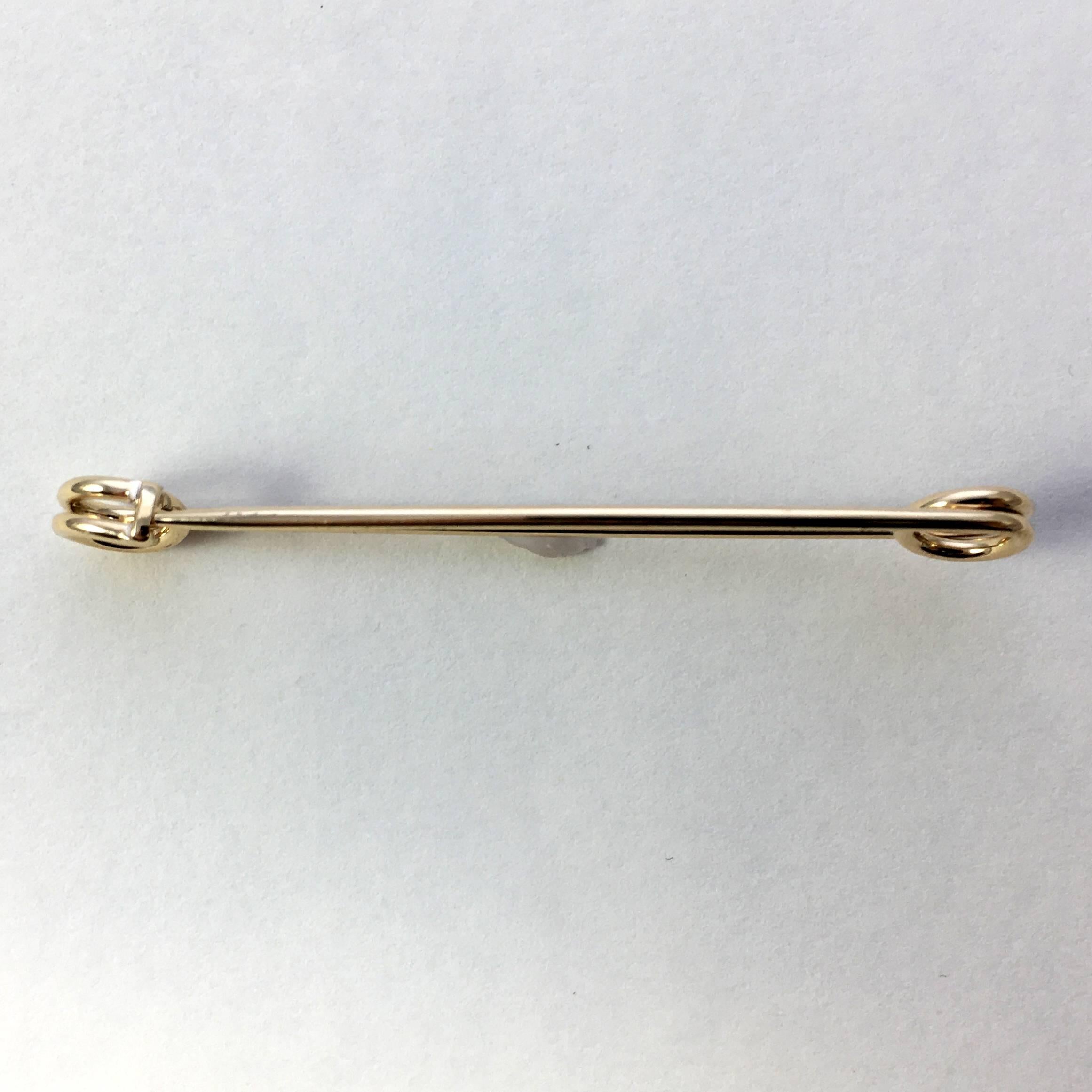 A 14 carat gold safety pin brooch by Tiffany & Co. 

The humble safety pin has been worn in many ways over the years from the heady days of the punk movement through to more recently as a symbol of resistance, security and solidarity. 

Signed