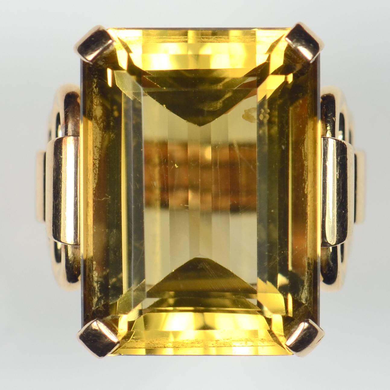 The 1940s were all about big bold cocktail rings and this is a fabulous example of that period.  The large emerald-cut citrine has a mellow honey colour and weighs approximately 27 carats with excellent clarity.

The citrine is set to an 18 carat