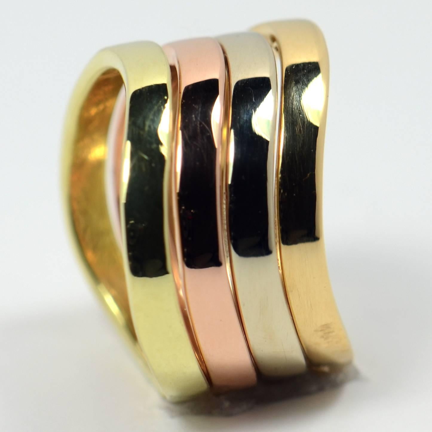 Four French undulating gold stacking rings by Jean Dinh Van in yellow gold, rose gold and white gold.

These rings were made to be stacked! Each ring has a sinuous wavelike form in yellow, rose and white gold, with a fourth shade that is a mixture