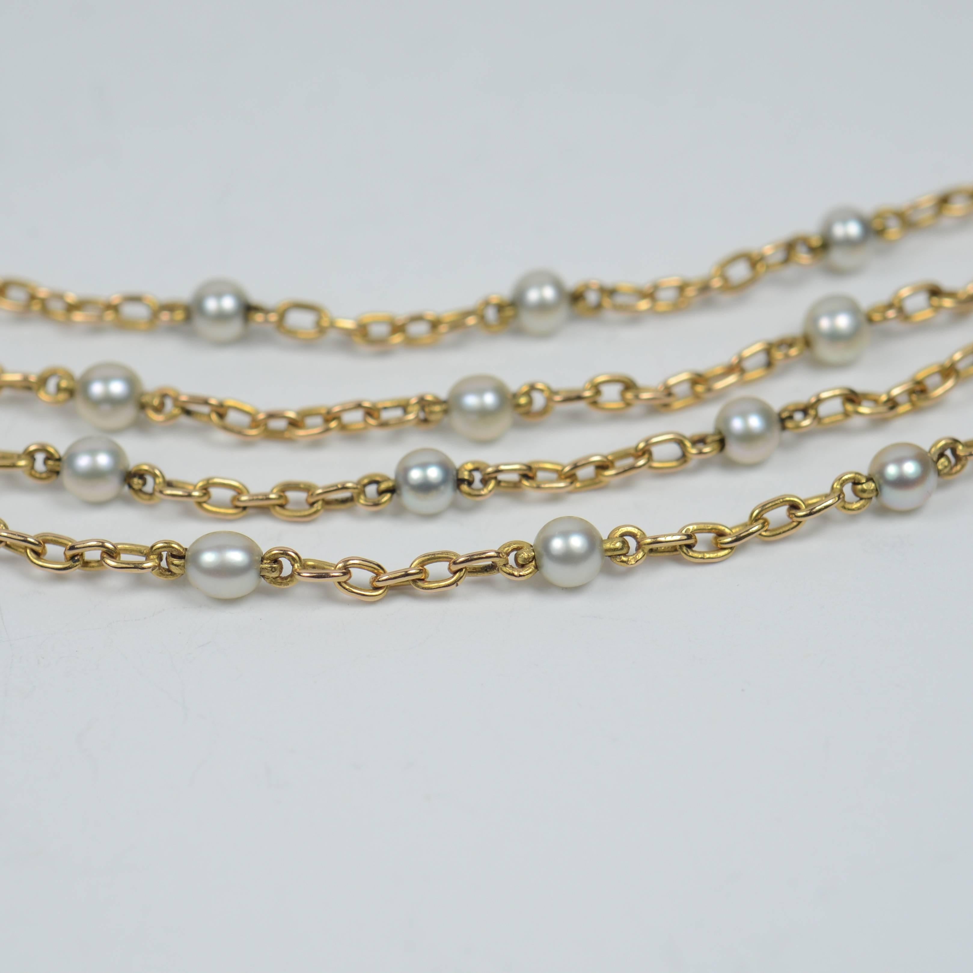 long pearl and gold necklace