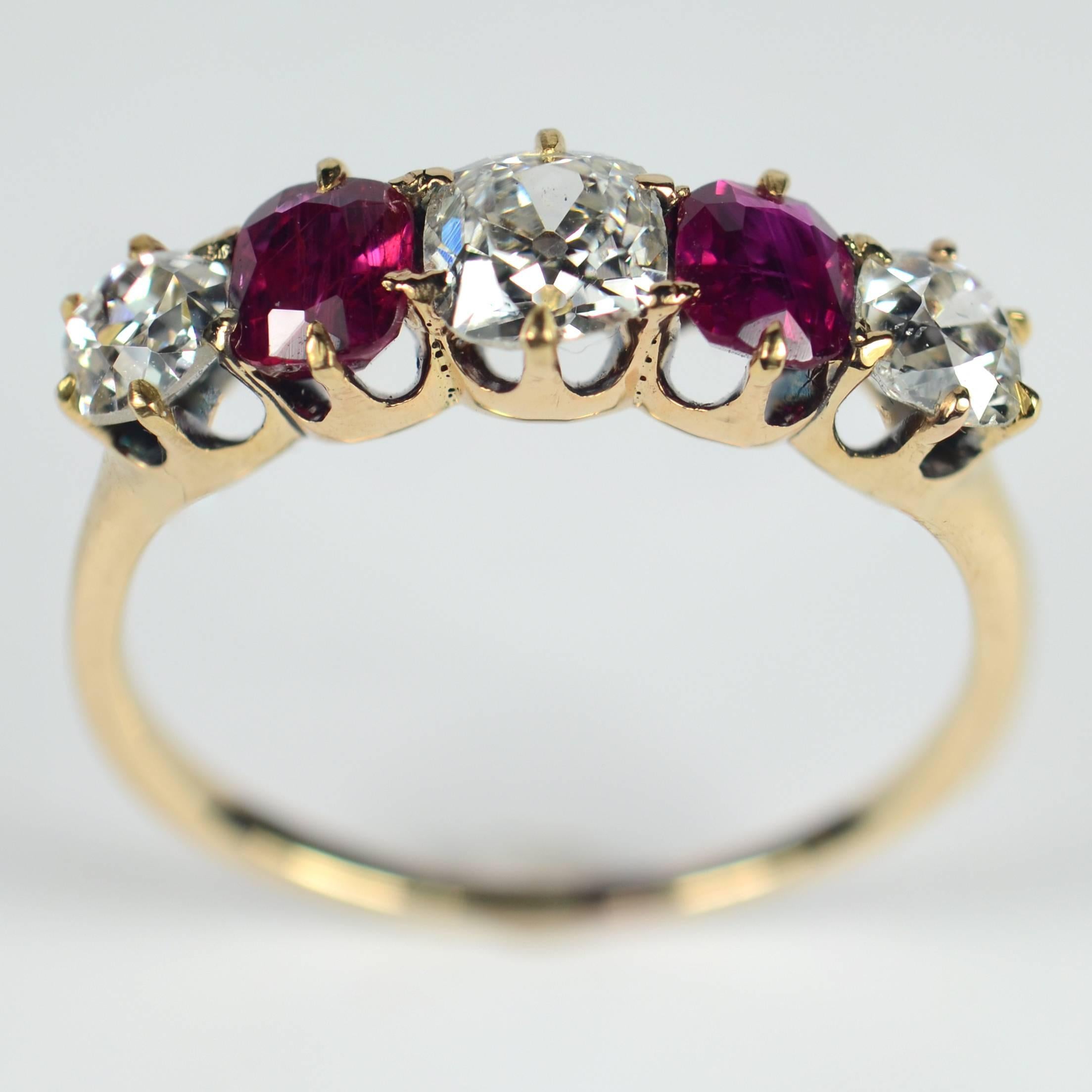 A classic Edwardian five stone ring set with three bright and lively old-cut diamonds and two cushion cut rubies of Thai and Burmese origin.

The diamonds weigh a total of approximately 1.23 carats and are G-H colour and VS-SI clarity (very slightly