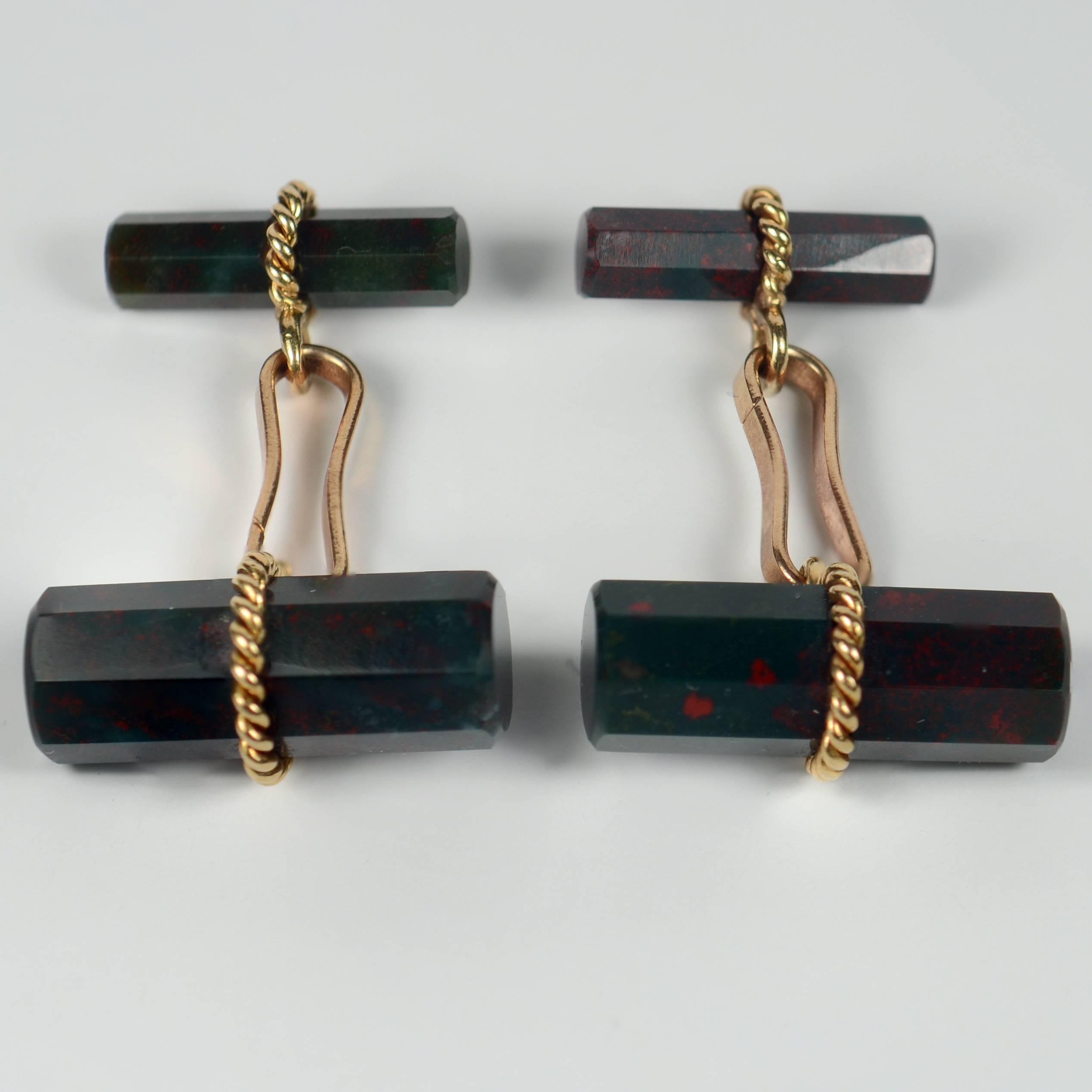 A smart pair of cufflinks by the French house Marchak, set with two octahedral cylinders of bloodstone quartz (a variety of chalcedony agate) with twisted gold wires. The bloodstone shows good coloration of red specks on a dark green ground.

The