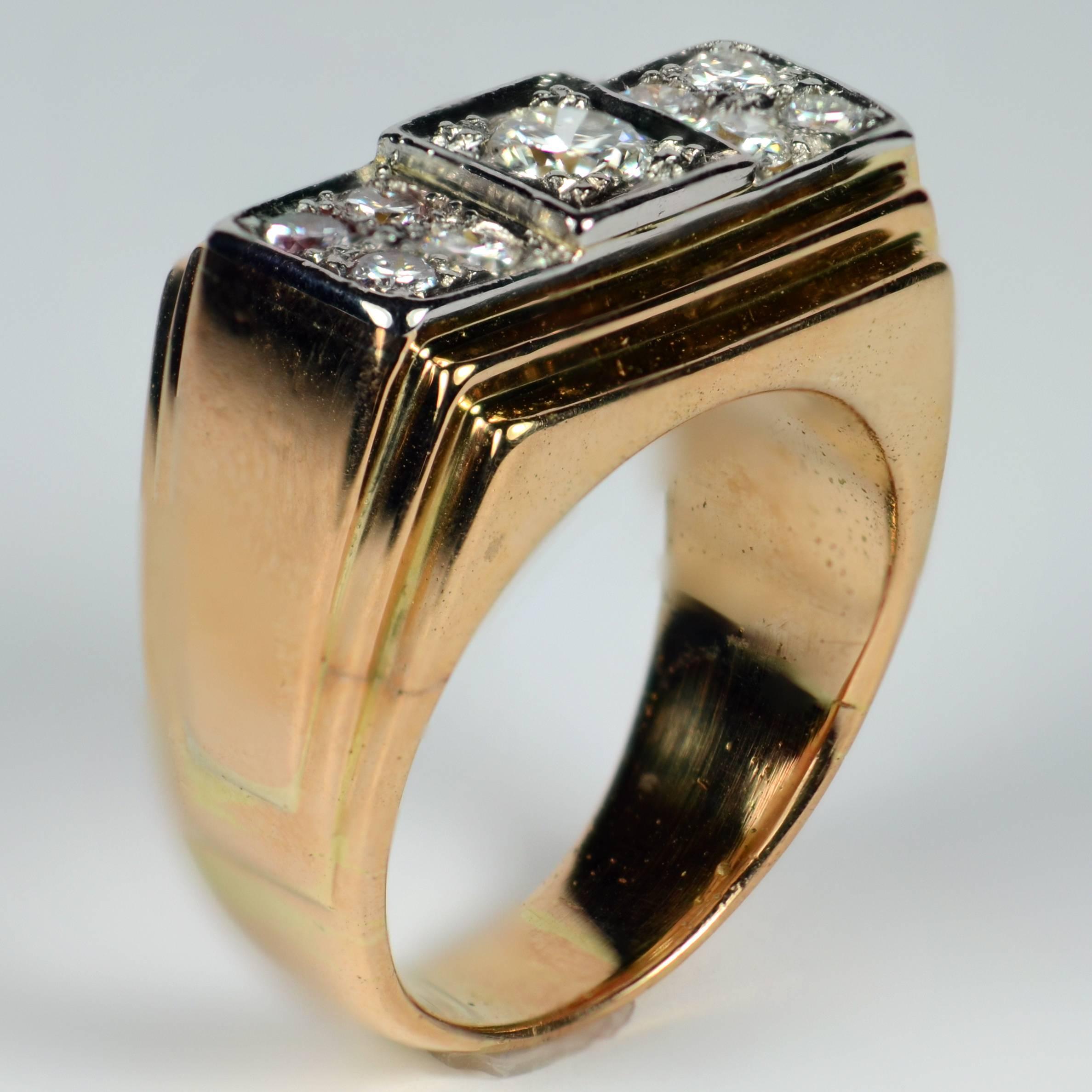 A very smart ring from the late Art Deco era with a stepped design in 18 carat rose gold and platinum, set with nine diamonds to the central section. The architectural feel of this ring is heightened by the stepped design to the tapered shank.

The