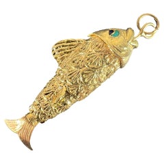 Ciondolo a forma di pesce articolato in oro giallo 18K