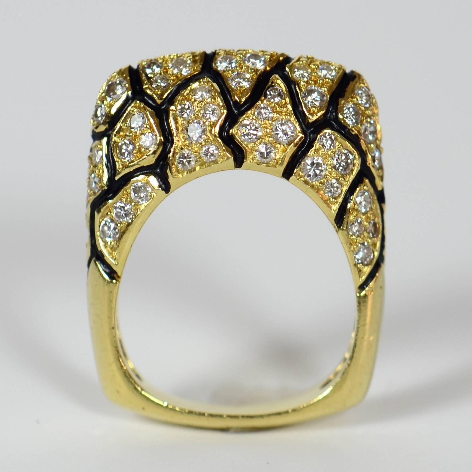 A fabulous animal-print 18 karat gold, enamel and diamond ring by La Triomphe.  

This bold and decidedly cool ring is set with 2.50 carats of white diamonds, separated into groups by undulating lines of black enamel.  The shank has a smooth squared