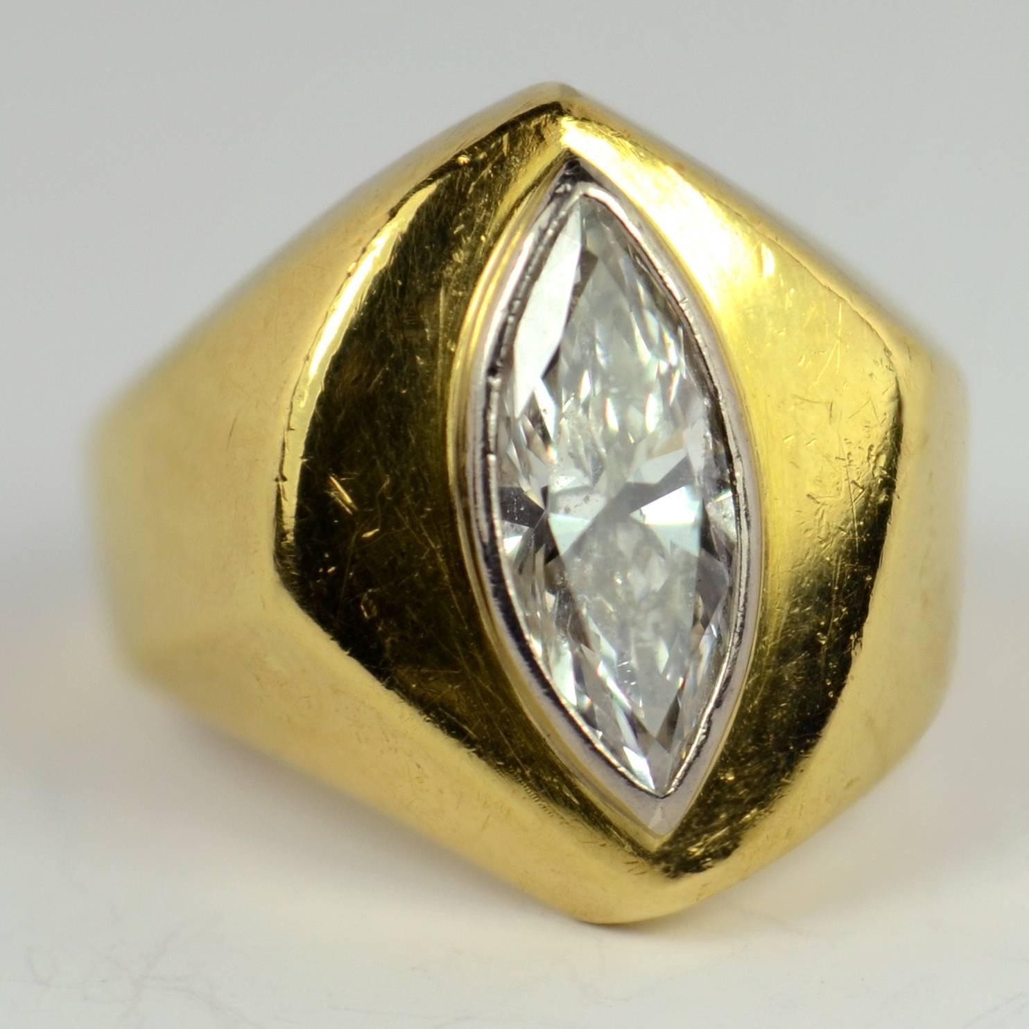 A stylish and original signet style ring set with a colourless marquise brilliant cut diamond with an approximate weight of 2.25 carat (estimated). 

Stamped 18K for 18 karat gold and American manufacture and signed Fretz.

Ring size: N.5 (US size