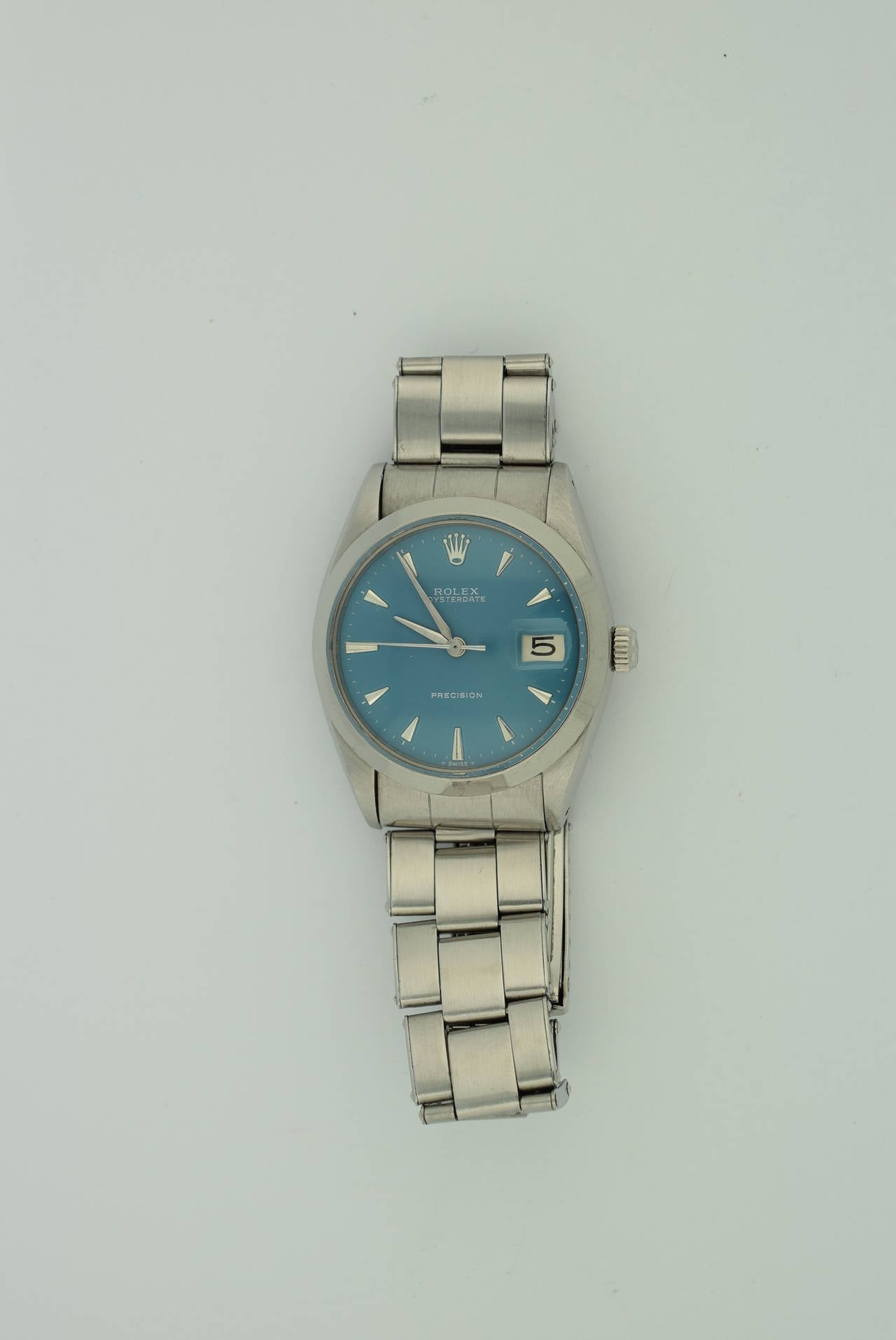 Rolex Oyster Date Stainless Steel, Reference 6694. Circa 1960. 
Very good condition with Rolex Oyster Band. Manual Wind.
Rolex Box and comes with a Refreshed  Rolex Dial in Blue.
Serial Numbers :1310xxx Case size: 34mm or 1 3/4 L x 1 3/8 w