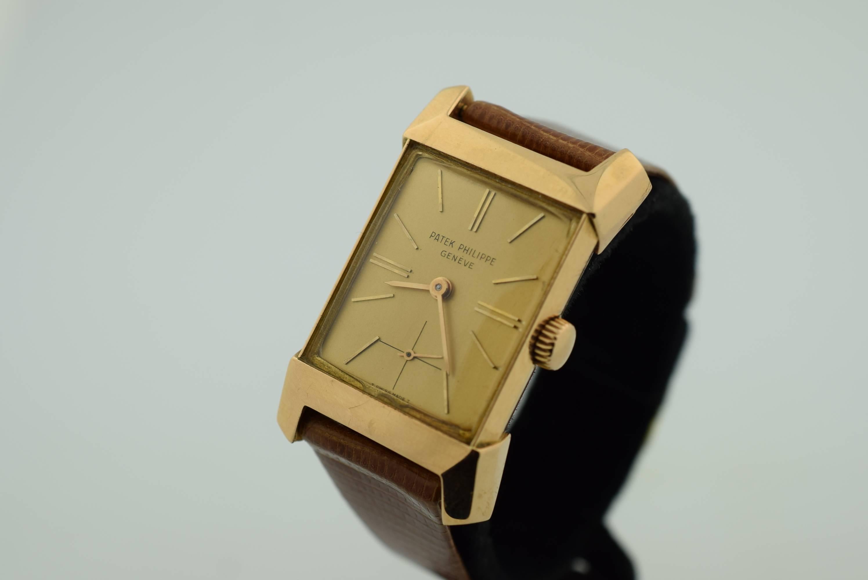 Patek Phillippe Vintage 1950,s 18K Pink Gold Model 2553 Rectangular wrist watch in Very Good Condition . Manual Wind .9-90 Patek Movement .
34mm x 24mm .Pink Dial with Pink Gold Hour markers .Classic Retro Style .
Comes with Patek Lizard Grain