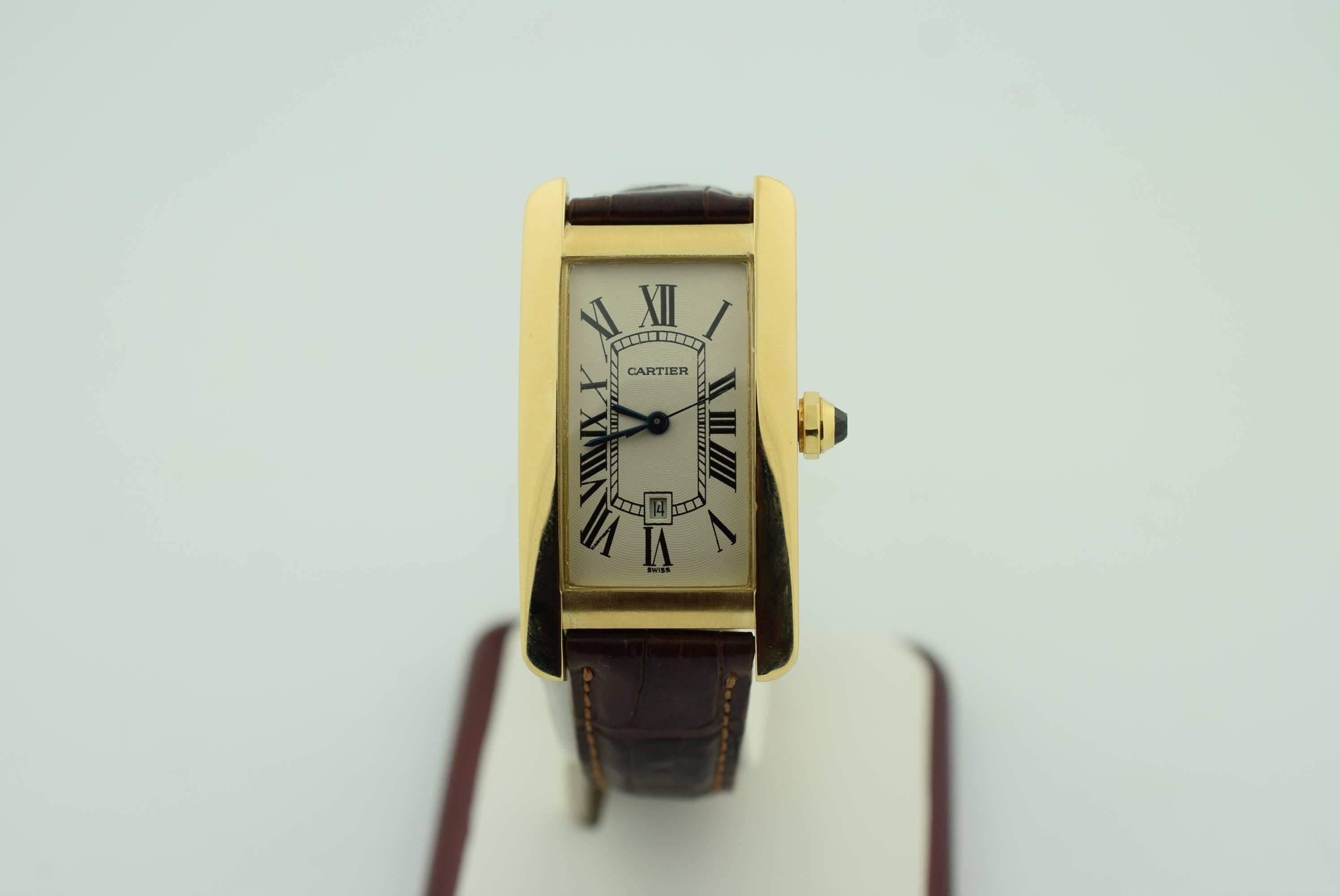 
18k yellow gold case with a brown leather strap. Blue steel hands and black Arabic numeral hour markers. Minute markers around an inner ring. Quartz movement. Scratch resistant sapphire crystal. 18k Yellow gold octagonal crown. Solid case back.